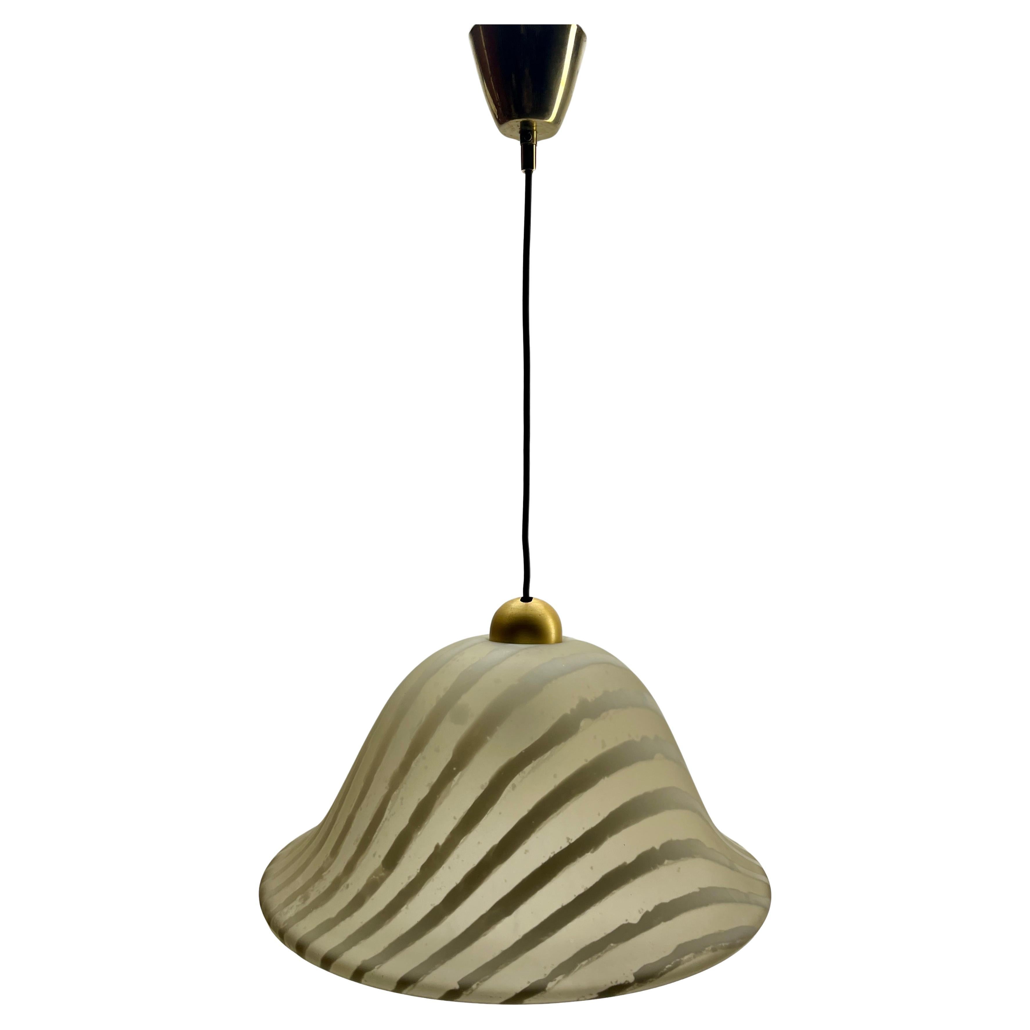 Lamp made by Peill & Putzler in the 1970s. Their unique patterning awareness of light patterns and their use of frosted glass to give a range of white shades was typical of Peill & Putzler's design ethic, focusing on both the design of the object
