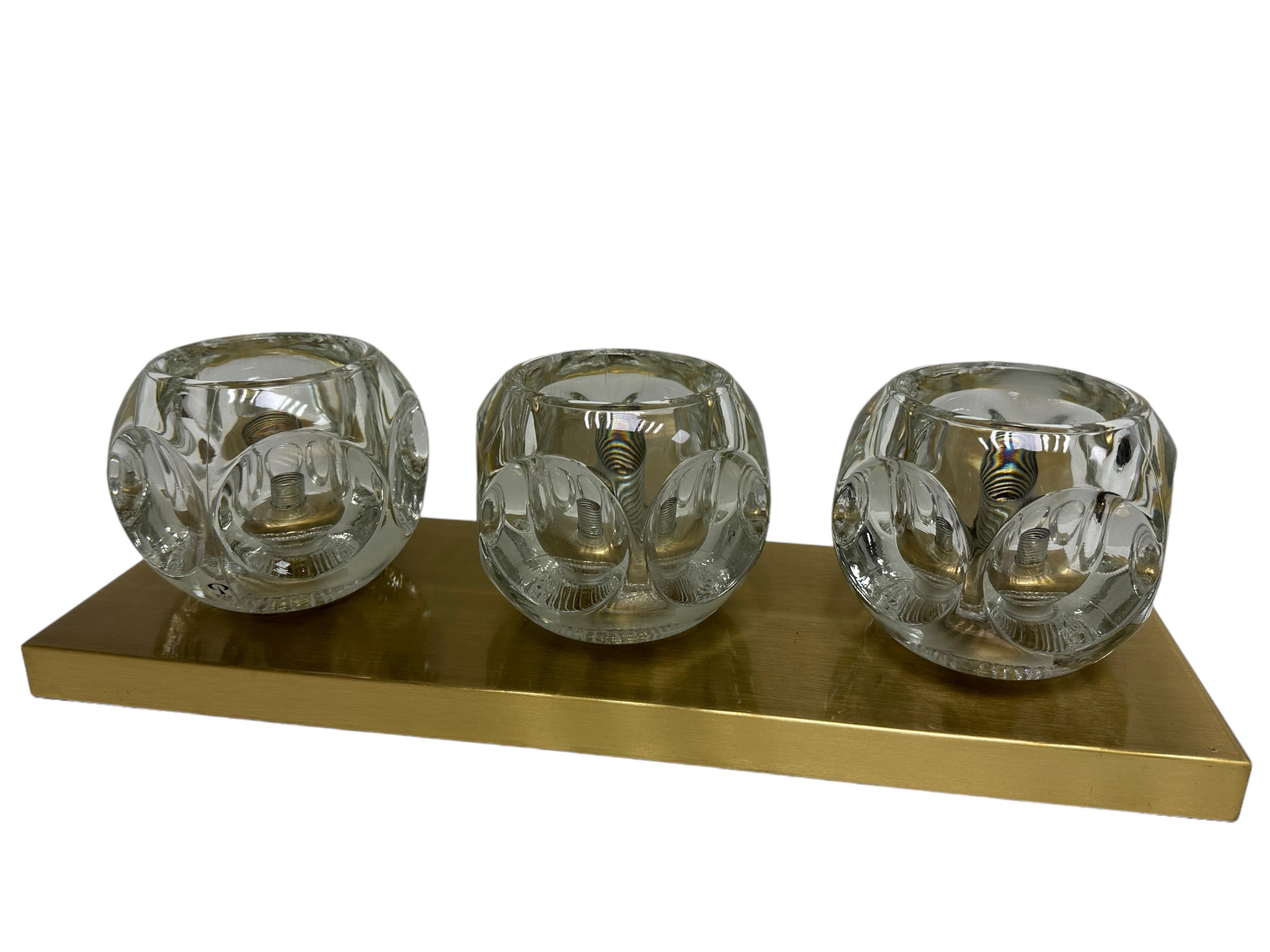 A beautiful petite ceiling or wall light lamp by Peill & Putzler, circa 1970s, in very good original condition. The fixture requires three European E14 / 110 Volt candelabra bulbs, up to 40 watts each. Looks great with a mirrored bulb. Nice addition