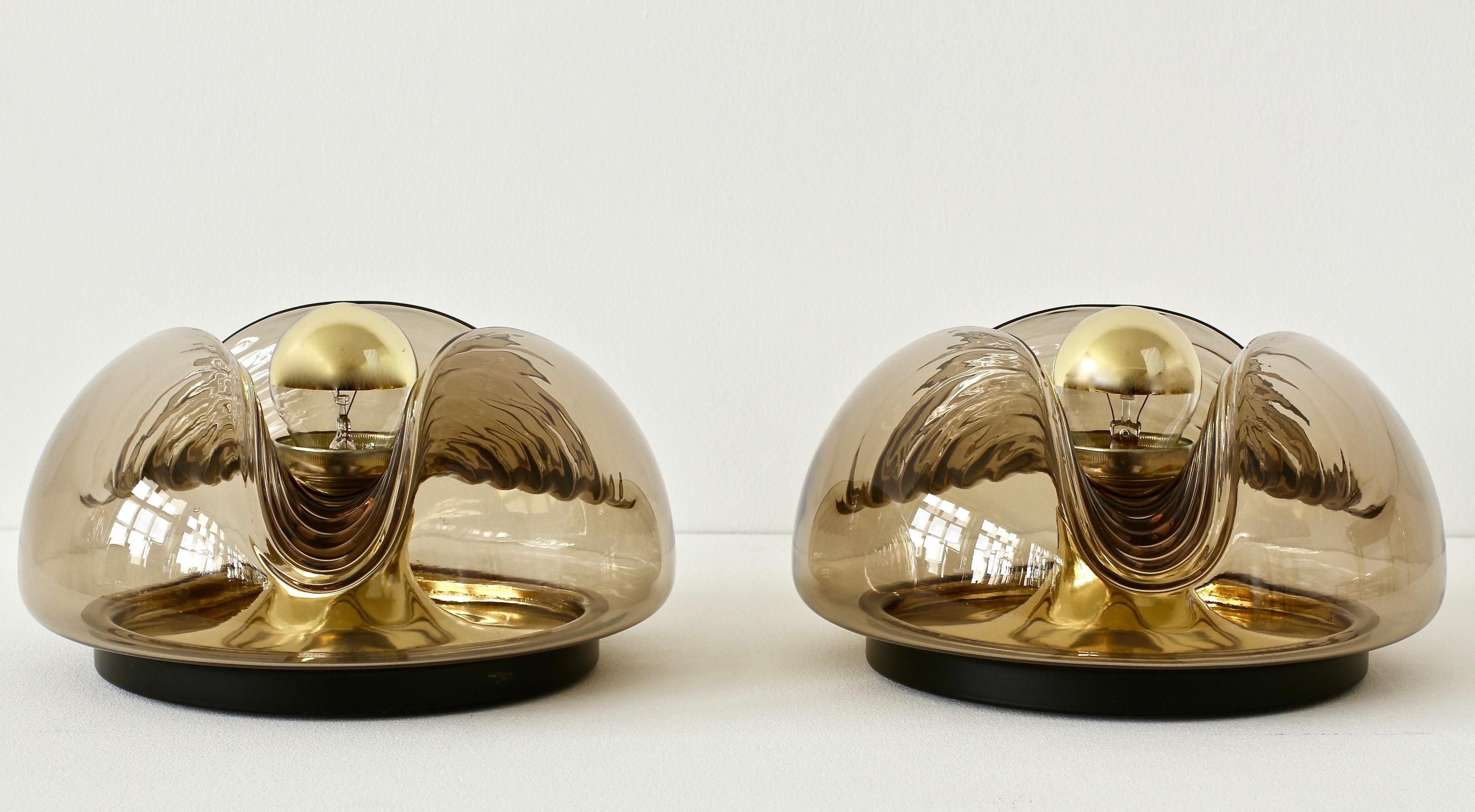 Peill and Putzler pair of midcentury flush mount wall lights or sconces whose design is attributed to Koch & Lowy in the 1970s. This range was called 