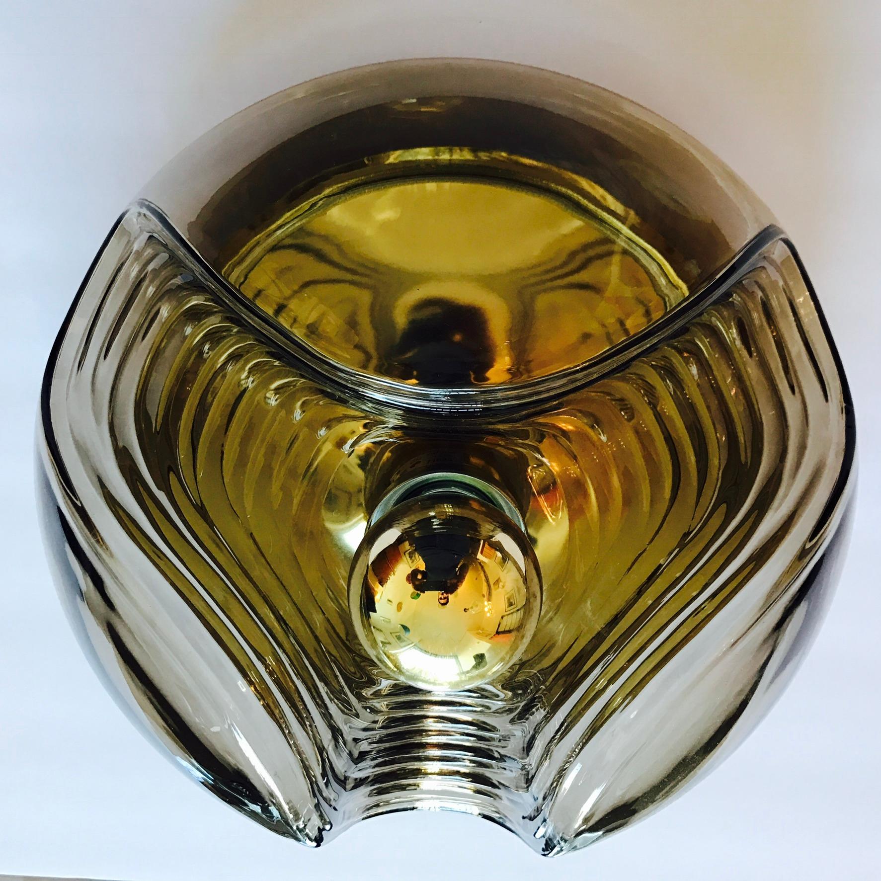 A great 1960s light smoked Space Age Flush lamp with a decorative ribbed glass shade on a reflective gold body. Made by Peill and a putzler. Newly rewired.