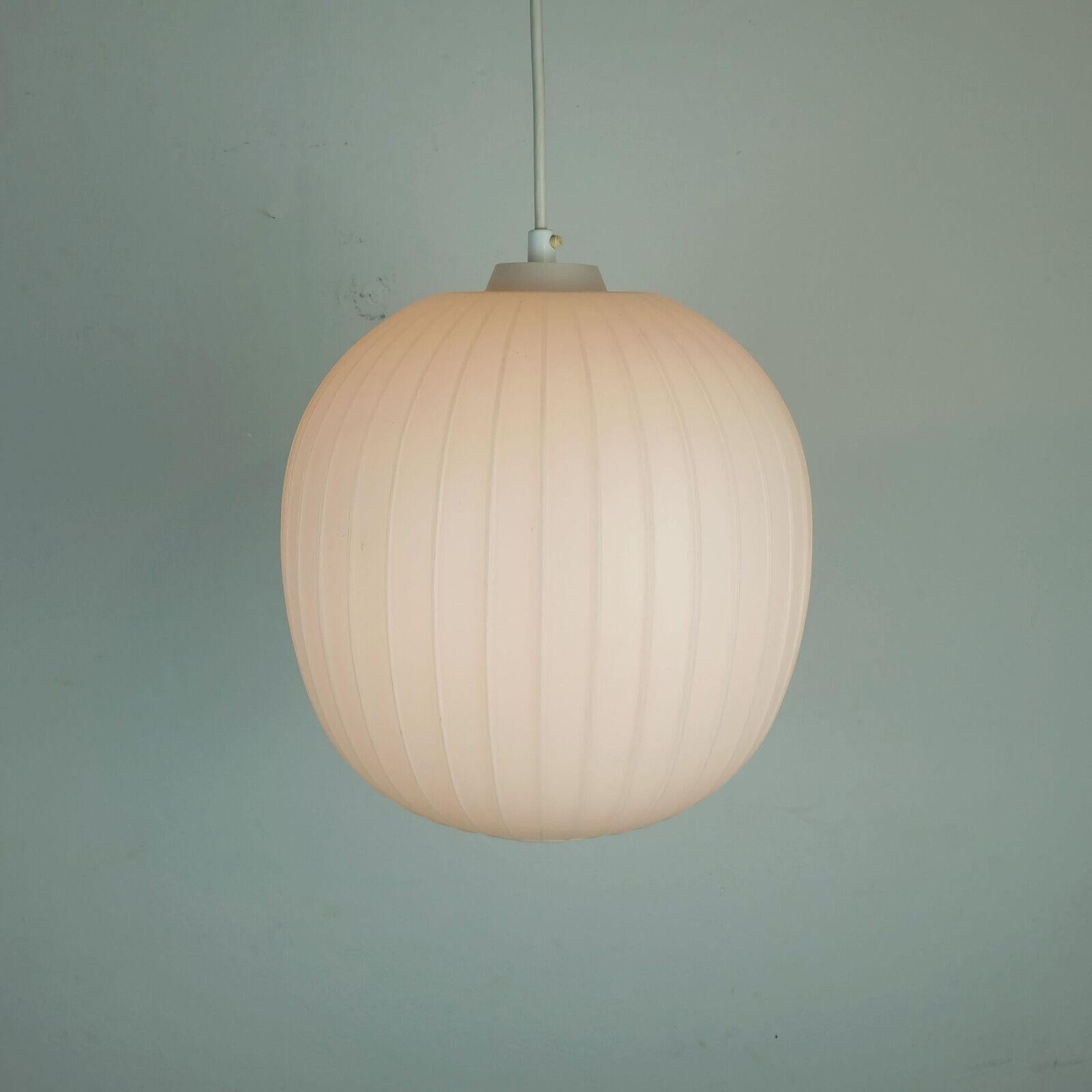Very elegant classic hanging lamp manufactured by Peill & Putzler. Designed by Aloys Ferdinand Gangkofner in the 1950s. Large round white opaline glass shade with stripe relief surface.

Dimensions in cm:
Overall length from ceiling 130 cm (can be