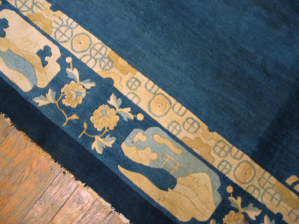 An open sapphire blue field, with the most discrete of cloud band pattern corners, makes this a most adaptable carpet in respect to furniture placement. The classic Chinese blue and white palette extends to the border with cartouches enclosing