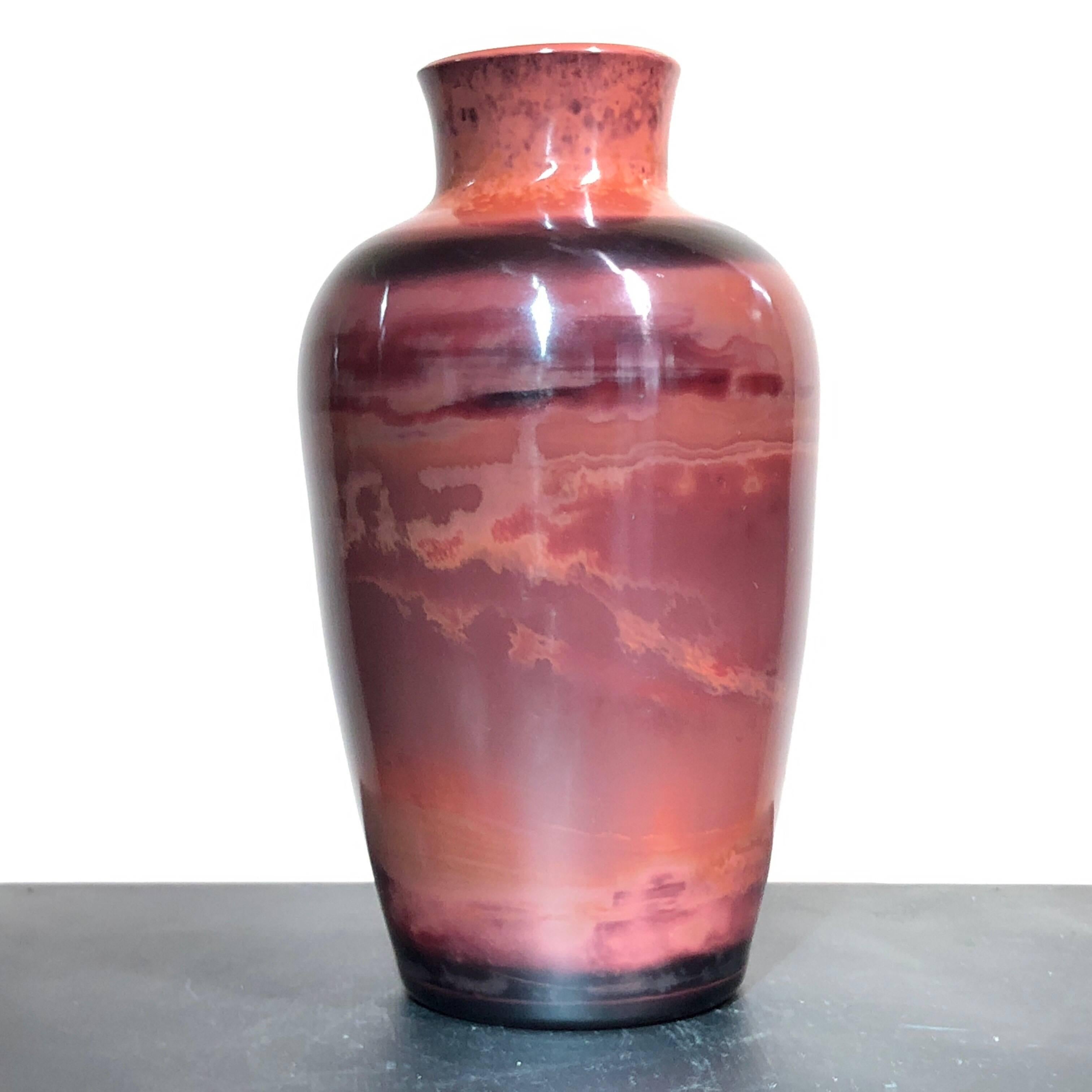 Peking glass vase of baluster form, banded in tones of red and ochre to simulate serpentine stone,
circa 1900.