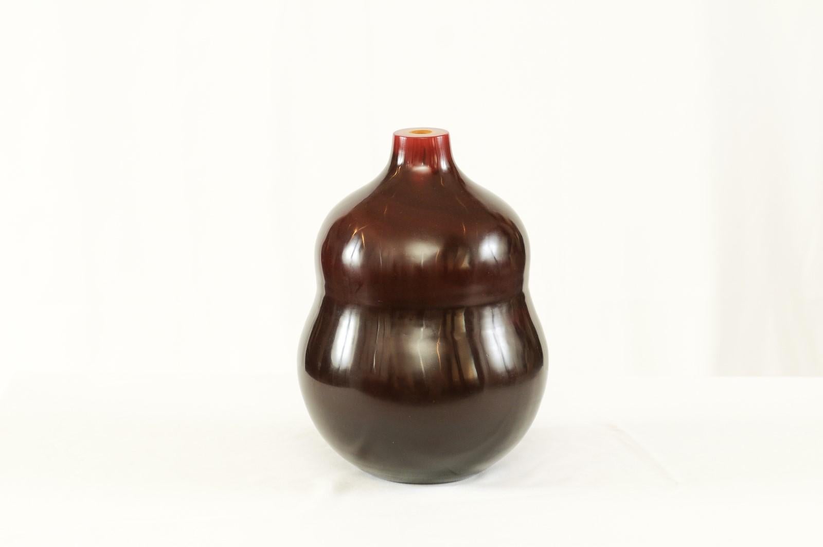 A beautiful Peking glass vase by Robert KuoHandcrafted in the 400-year-old technique of Peking glass, this Robert Kuo vase is masterfully mouth-blown from layer upon layer of glass, then shaped and polished by hand. Though its lineage is deeply