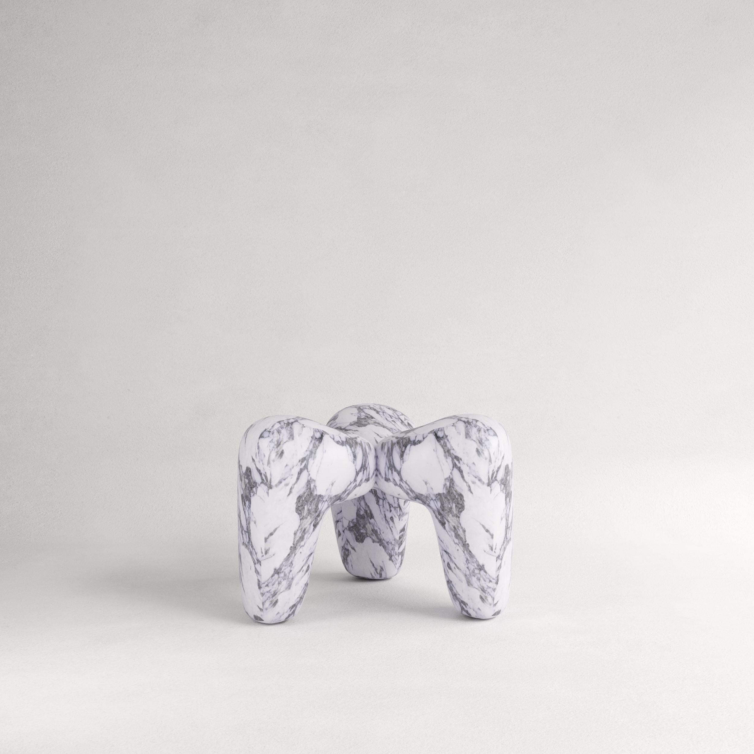 Pele de Tigre Triplo Stool by Andre Teoman Studio
Dimensions: W 70 x D 70 x H 45 cm
Materials: Marble

Introducing Triplo, a marble stool that challenges traditional perceptions of rigidity and weight. Crafted from marble, Triplo perfectly balances