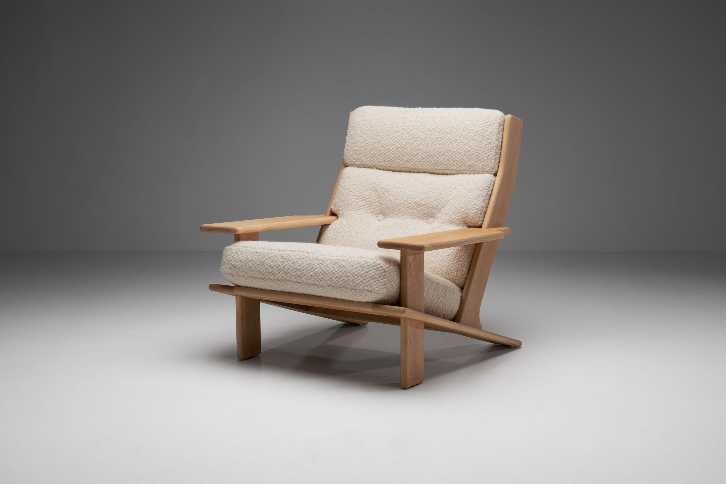 Rare “Pele” lounge chair by Finnish designer Esko Pajamies, manufactured by the Finnish furniture company, Lahden Lepokalusto Oy in the 1970s.

This “Pele” lounge chair is made from solid oak. The wooden frame has a beautiful matte finish, while