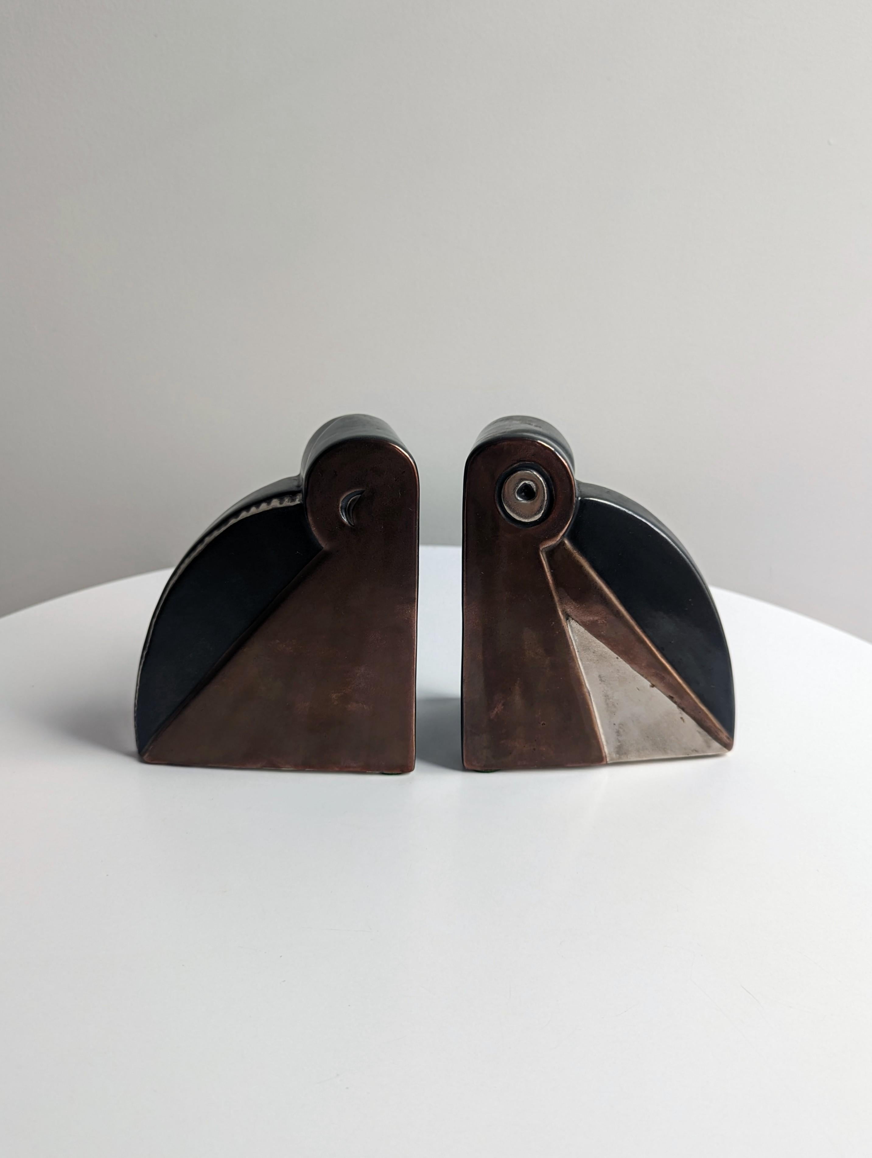Important and rare Art Deco bookends designed by Albert Drexler Jacobson(1895-1973). Fantastic modern and geometric shapes with three color glaze combinations that truly make this set extra special and a worthy collectors piece. This bookend design