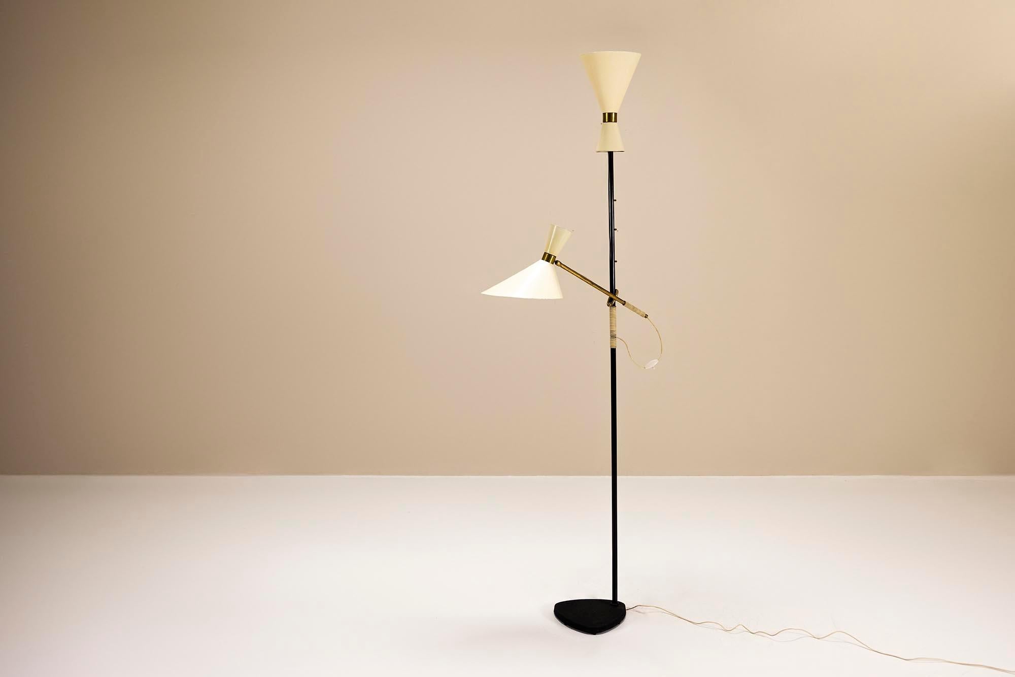 We are very enthusiastic about this ‘Pelikan’ Floor lamp by J.T. Kalmar, a striking masterpiece from the 1950s, produced in Austria. This stunning creation combines the luxurious warmth of brass with the sleek sophistication of lacquered steel,
