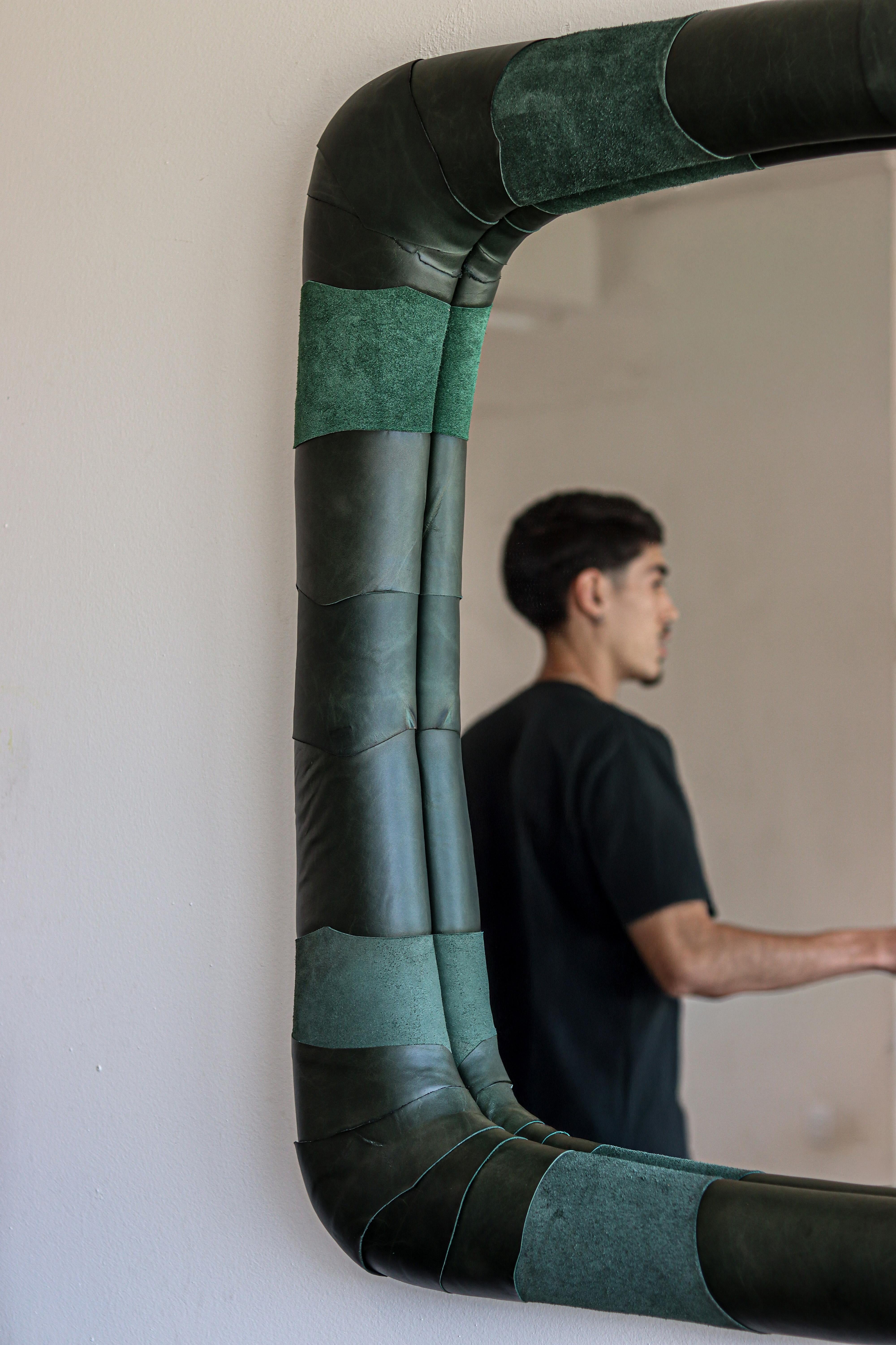 Pelle Mirror

The Pelle Mirror is born from the intention to give new meaning to leather remnants from our furniture production, applied to its upholstered frame.
By reusing this noble material, which instead of being discarded gains new form and