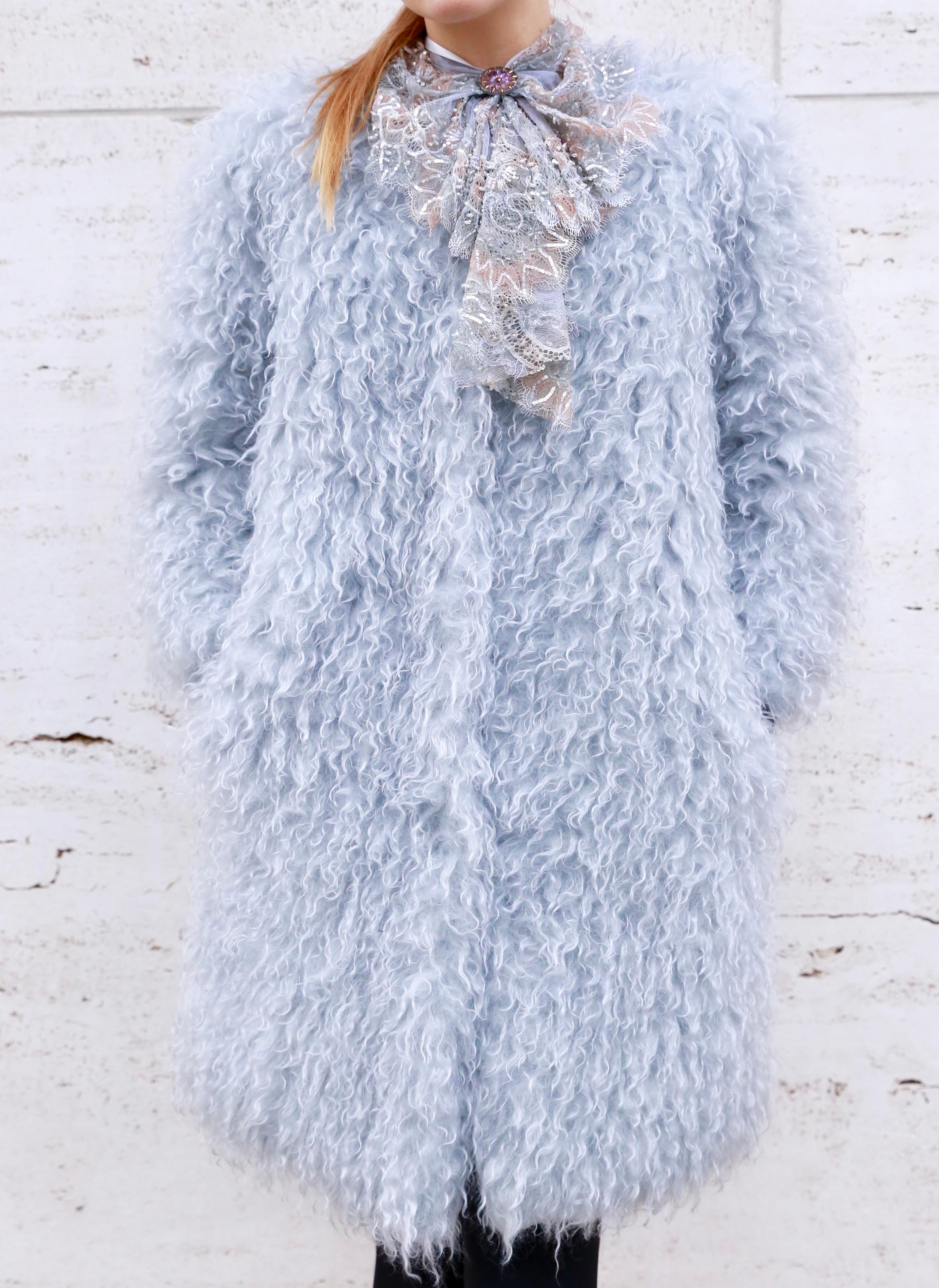 The Farrah baby blue mohair coat is a one of a kind exclusive piece. Featuring the highest quality mohair in the world made by an historic mill in Europe, this lightweight and extremely warm coat will be your favorite garment to wear during the