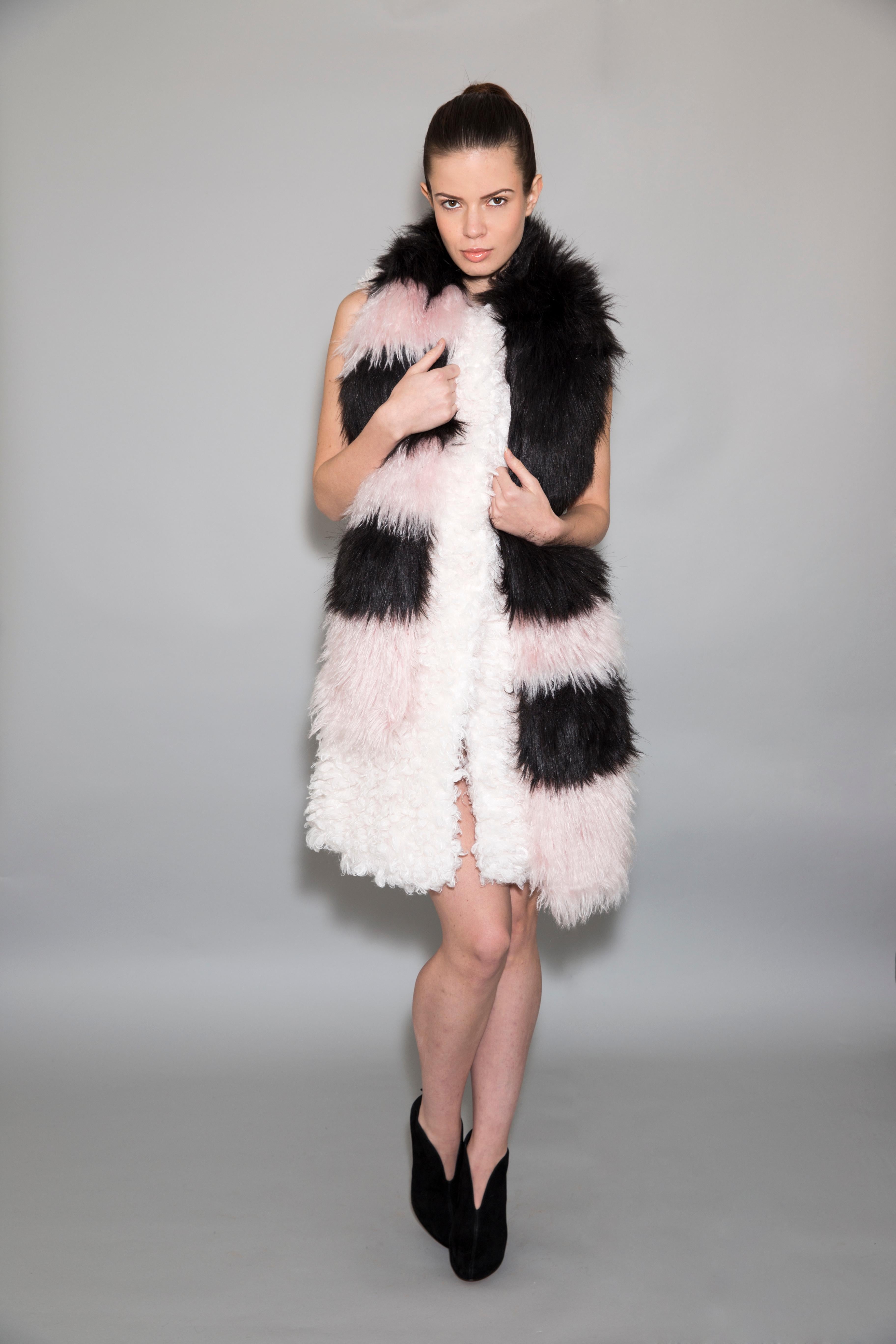 The Pelush Seuss black and pink faux fur and mohair scarf is a one of a kind piece. Featuring the best quality sustainable mohair and man made pelage, this stylish striped long scarf makes a fun and glamorous statement. Timeless, warm and useful