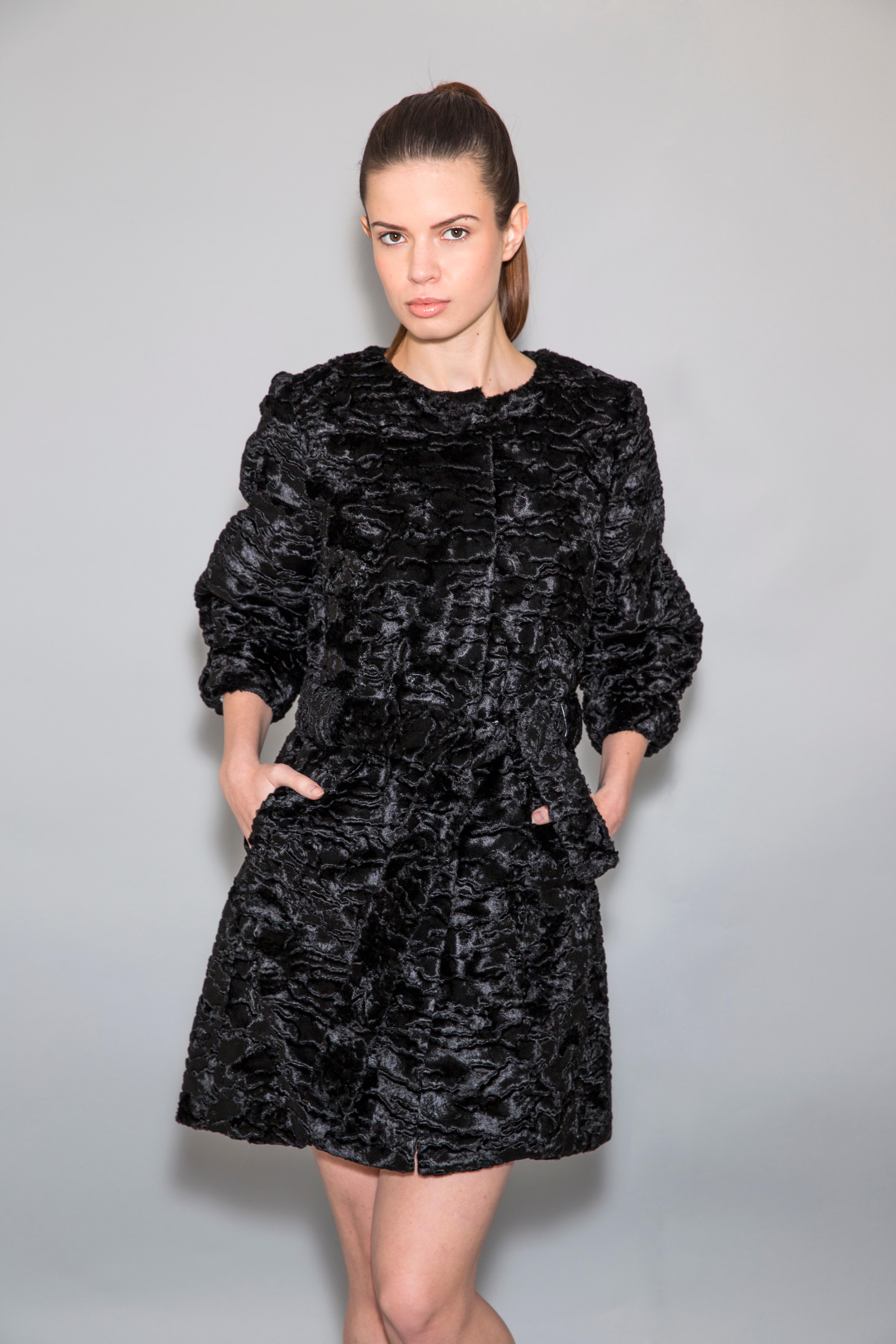 The Matilde black Astrakhan faux fur coat with belt is a one of a kind exclusive piece. Featuring the highest quality custom man made pelage, this velvety fur free coat is a stunning replica of the Astrakhan broadtail fur. Elegant, stylish and
