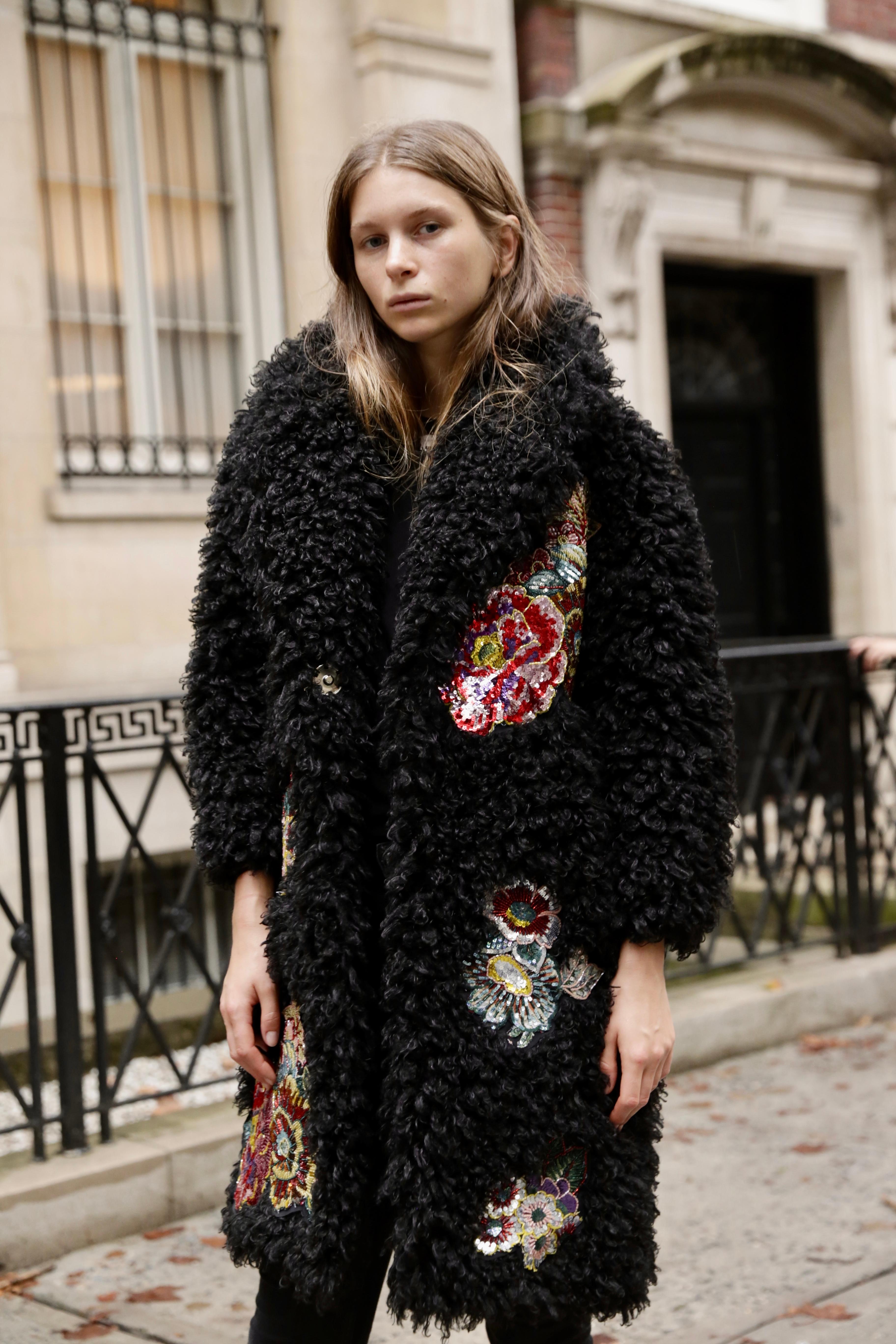 The Anna Pelush black boucle' faux fur coat with embroidered patches is a one of a kind exclusive piece. Featuring the highest quality man made pelage, the large poodle curls are custom made for Pelush. Featuring recycled frayed patches applique's