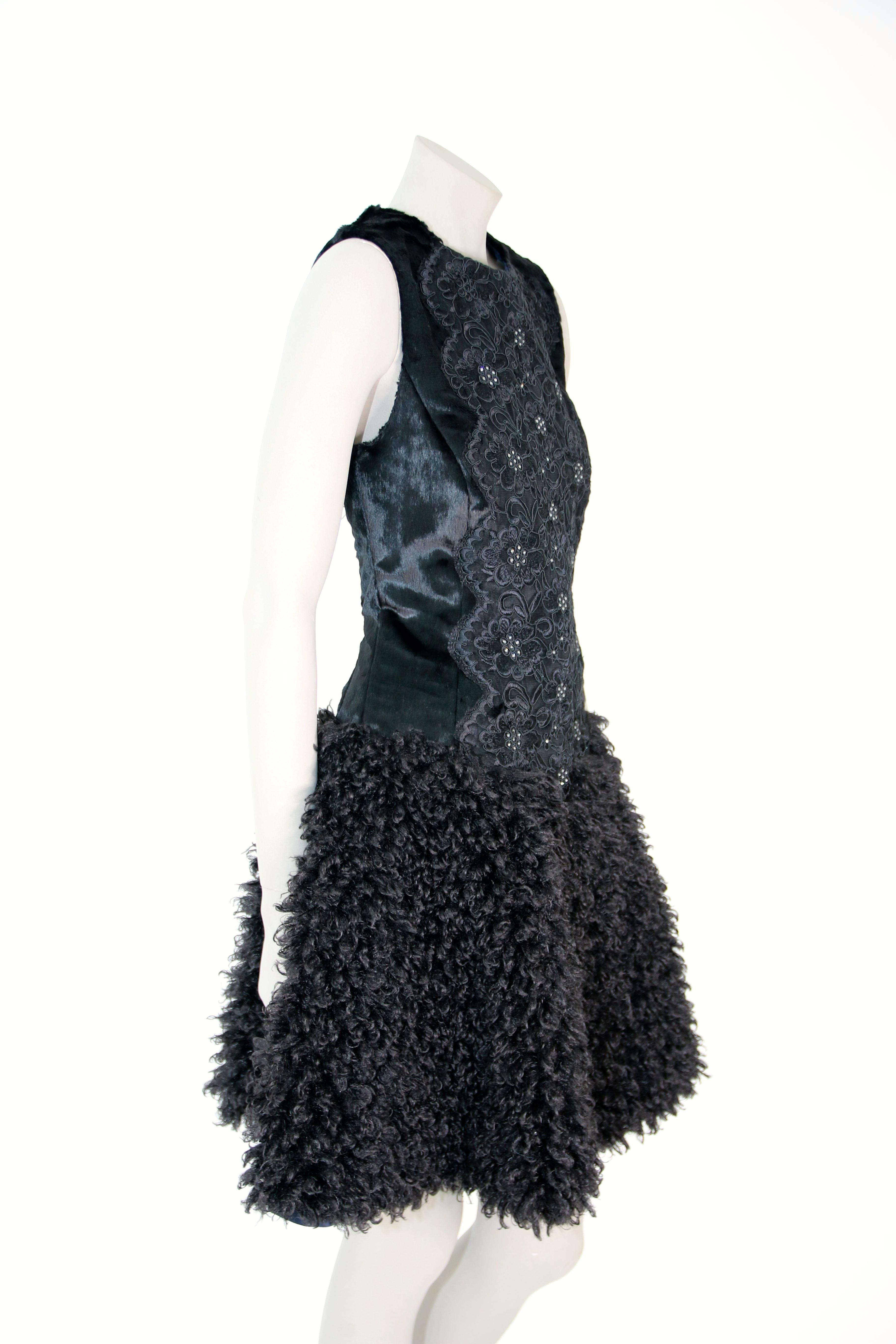 The Mia Pelush black faux fur dress with guipure lace and Swarovski crystals is a one of a kind exclusive piece. Featuring the highest quality man made pelage, this original fur free dress is a fun replica of a boucle' curly lamb fur, combined with