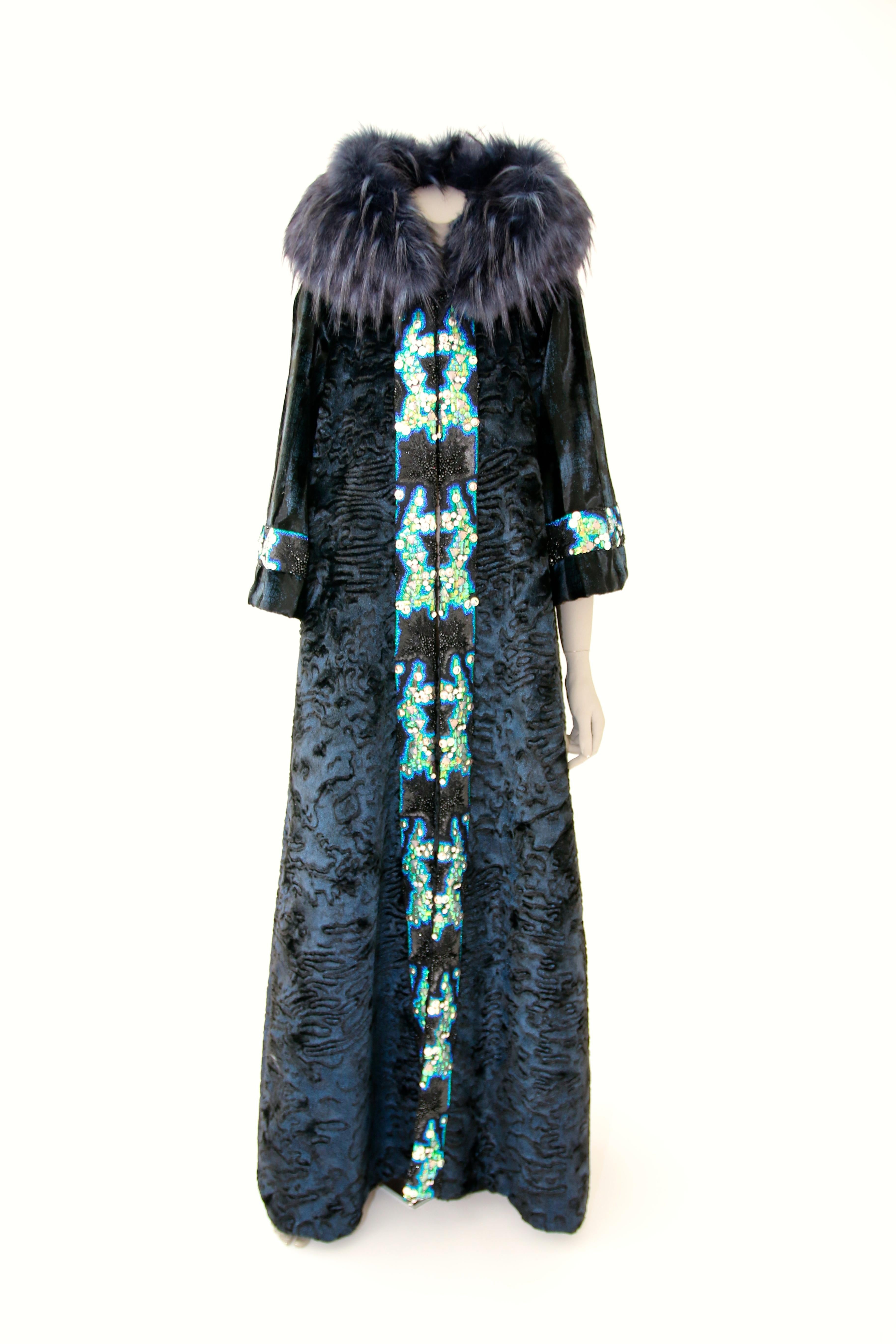 The Regina Pelush blue faux fur Astrakhan caftan coat with embroidery is a one of a kind exclusive Couture piece. This striking eye-catching fur free coat is crafted with the highest quality man made pelage for Pelush. The rich and sumptuous fabric