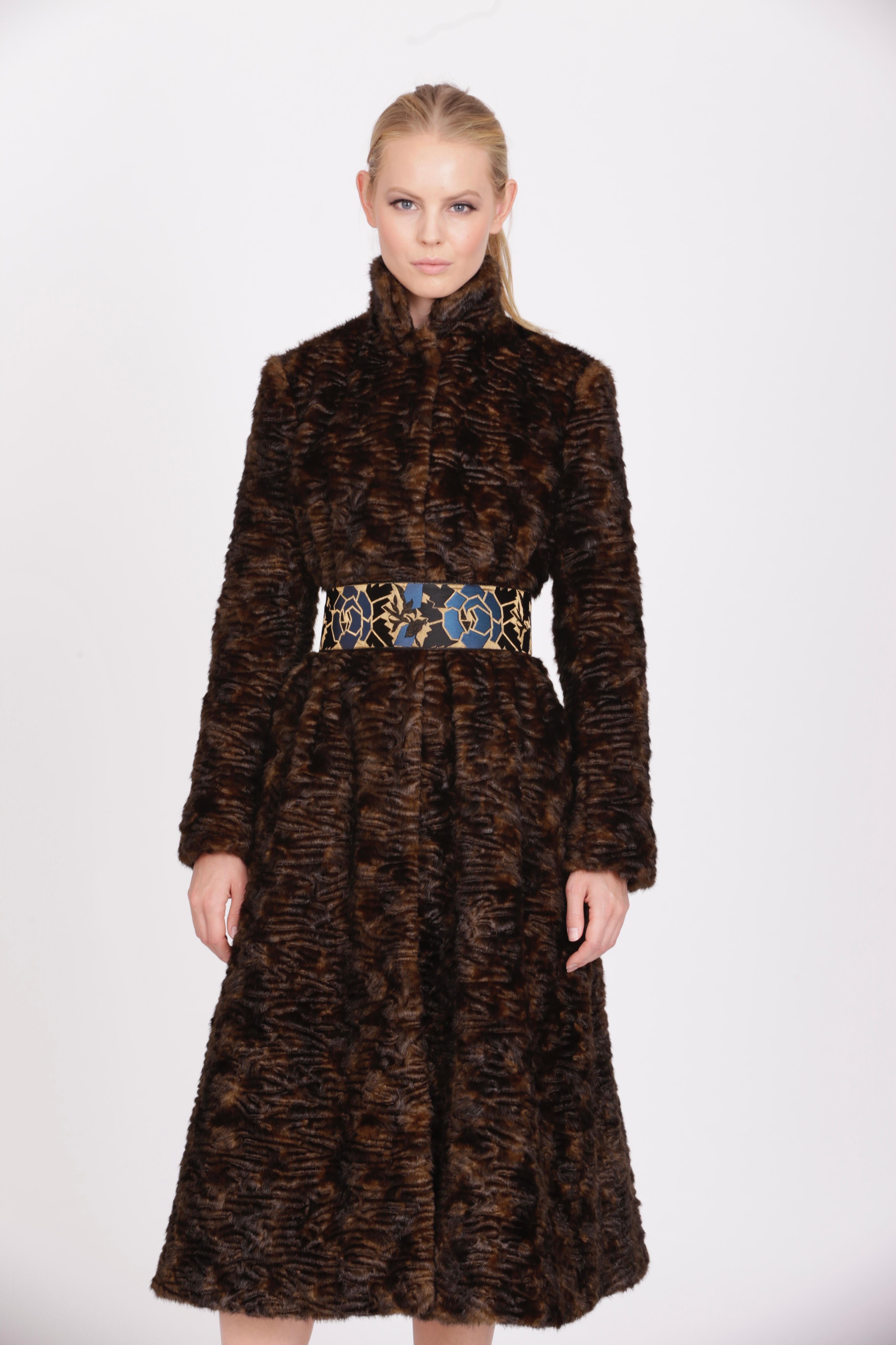 The Marissa Pelush Astrakhan faux fur coat is a one of a kind exclusive piece. Featuring the highest quality man made pelage, this stylish and warm fake fur coat is a beautiful replica of the Persian lamb fur. The Princess cut design highlights the