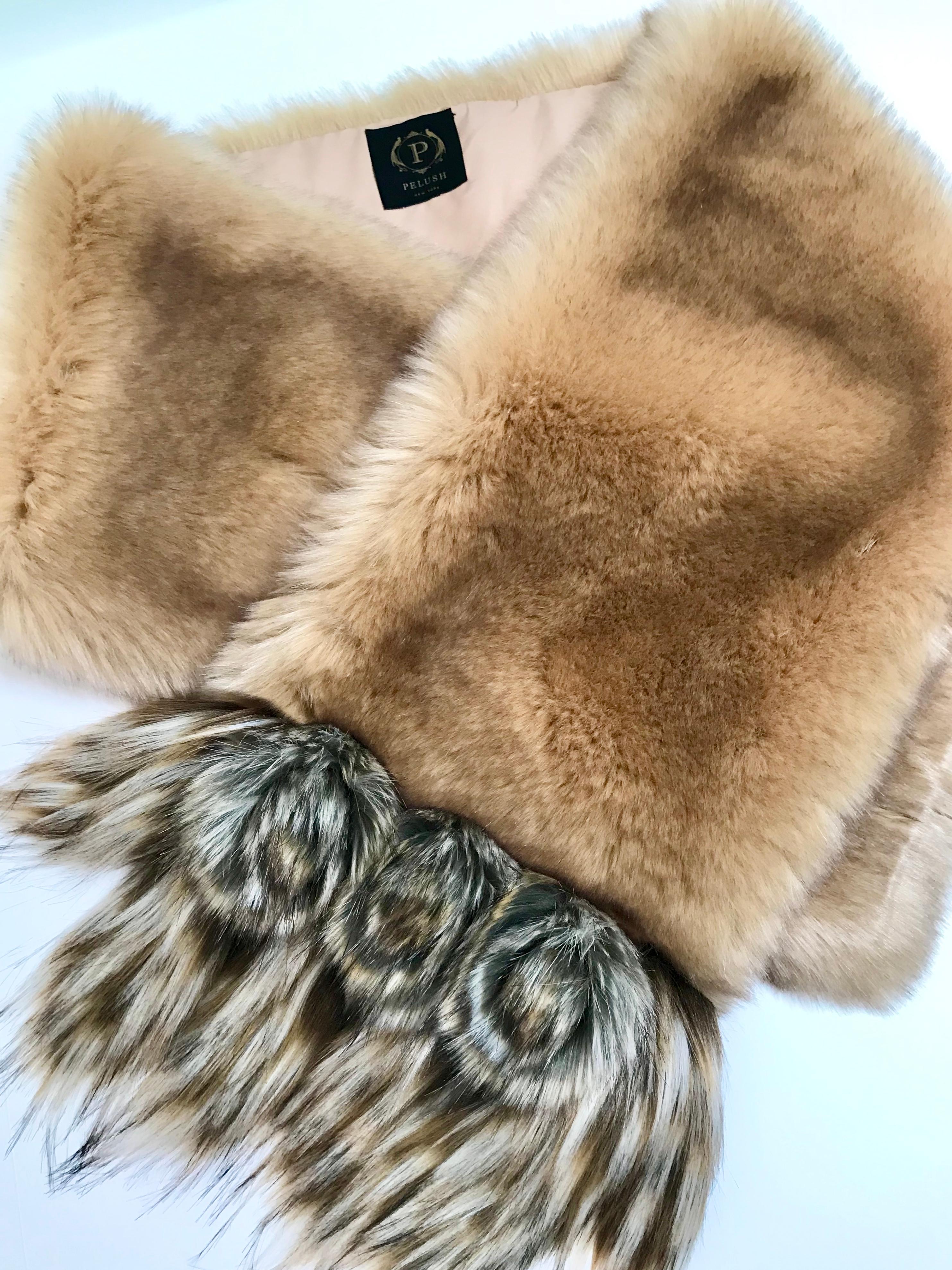 The Stella Pelush champagne faux fur chinchilla wrap/scarf with three dimensional rosettes is a one of a kind exclusive piece.
Highlighted by the highest quality man made pelage this extraordinary fur free accessory is a stunning replica of the