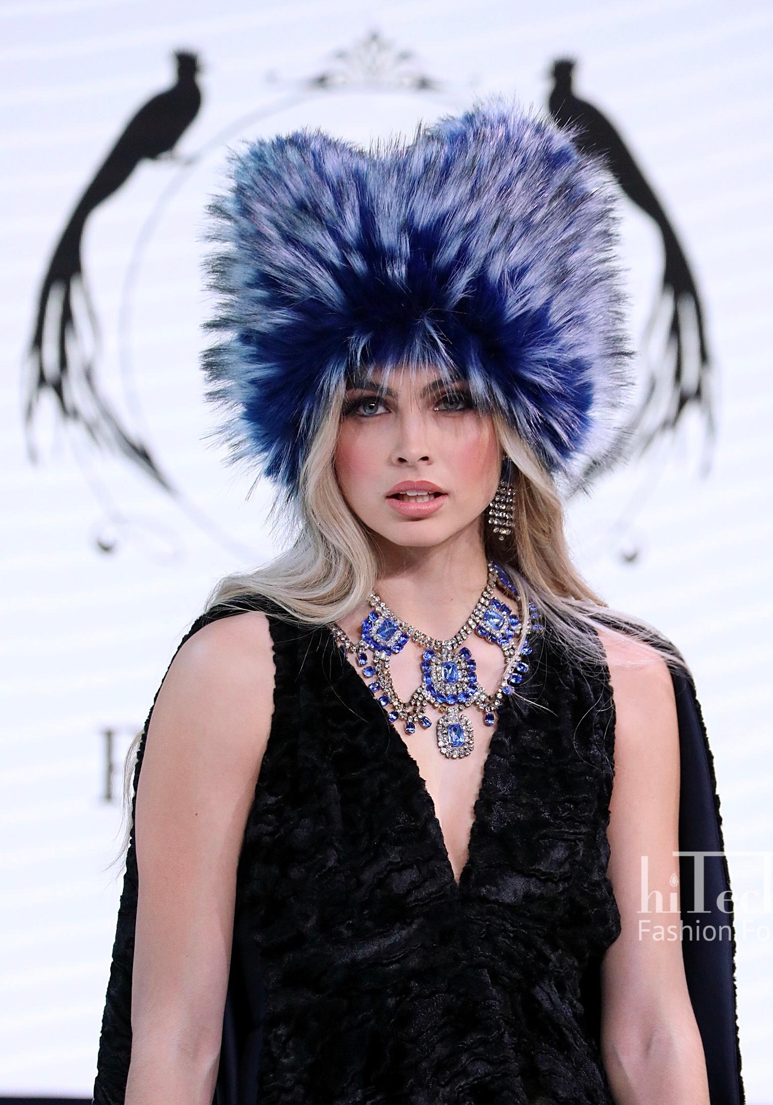 The Anastasia Pelush cobalt blue faux fur fox hat is a one of a kind exclusive piece. Featuring the highest quality man made pelage, this over the top fur free hat makes a striking fashion statement. The beautiful and soft fabric is a stunning