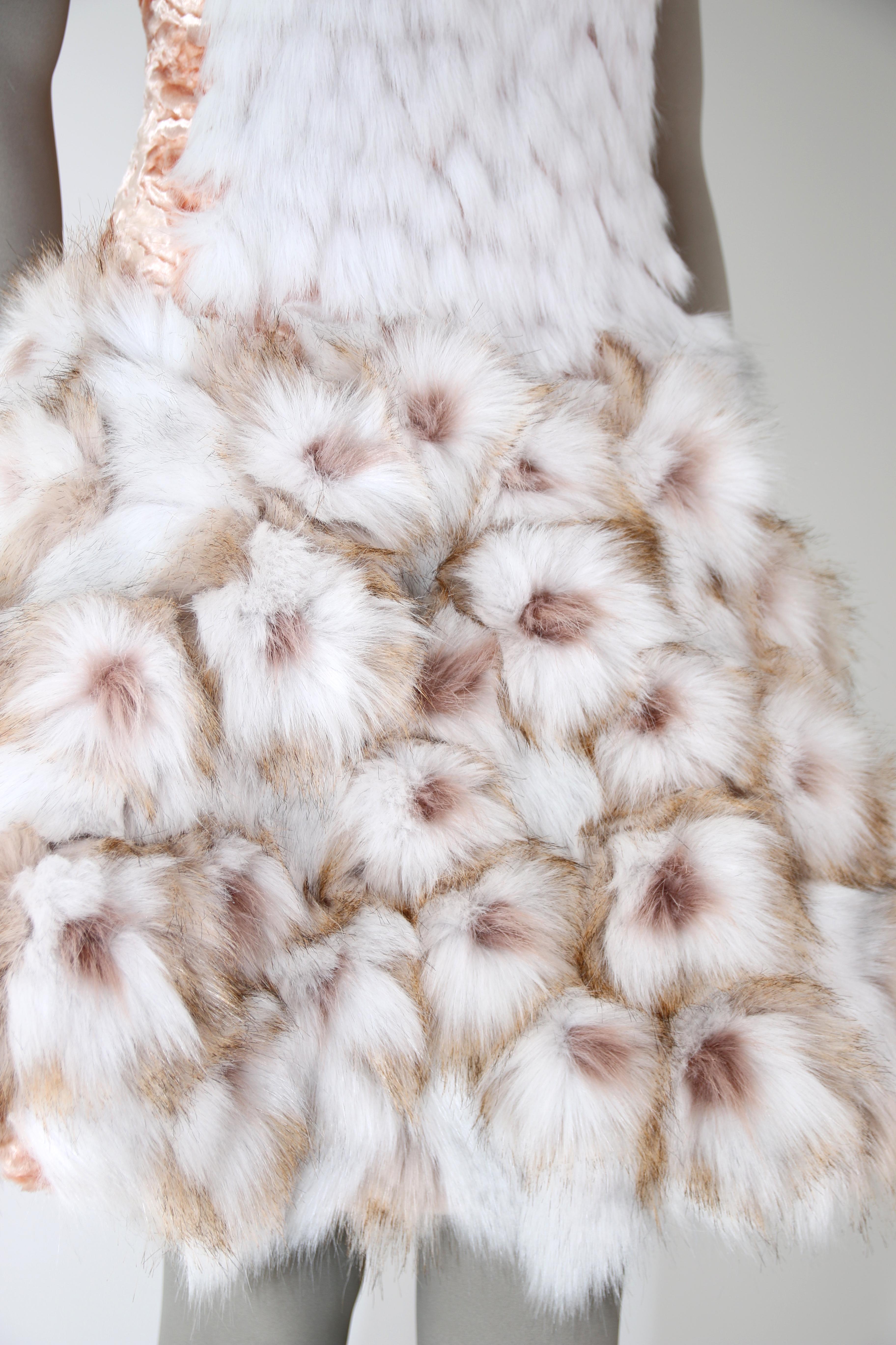The Bianca Pelush white faux fur dress with three dimensional flowers is a one of a kind exclusive Couture piece. Featuring the highest quality man made pelage this extraordinary fur free dress is a beautiful replica of the chinchilla, fox and