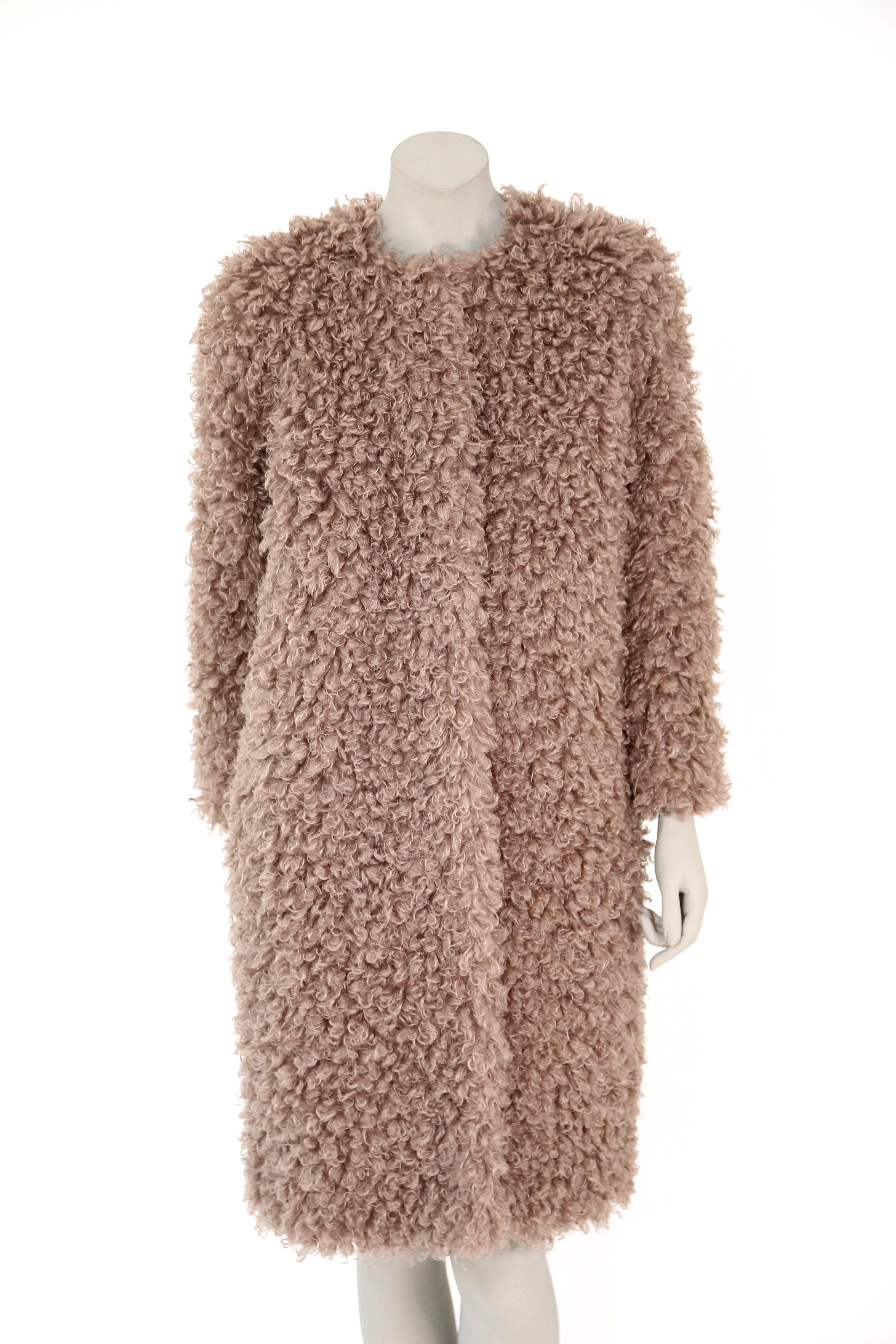 The Coco Pelush faux fur curly boucle' poodle coat is a one of a kind exclusive piece. Featuring the highest quality man made pelage the sophisticated mushroom color is custom made for Pelush and it mimics the curly lamb fur. Soft, lightweight and
