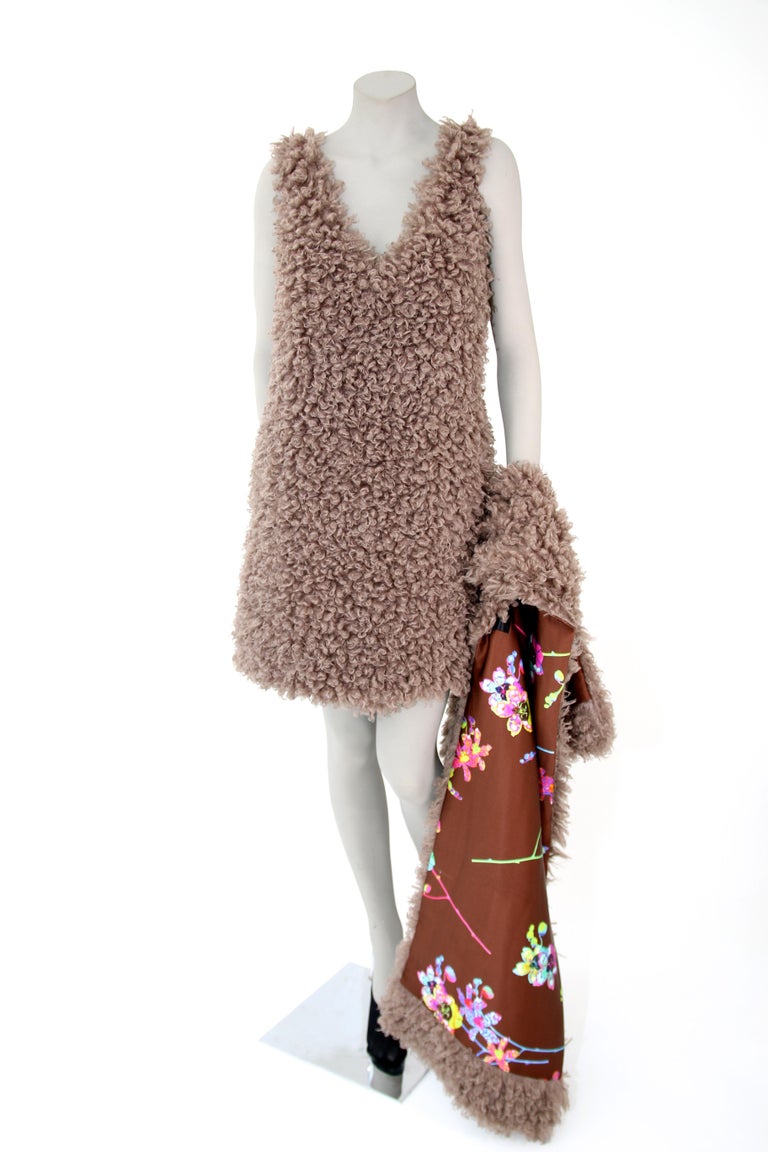 The Coco Pelush faux fur mini dress in curly boucle' is a one of a kind exclusive piece.
Featuring the highest quality man made pelage and a special custom made mushroom color, this fur free dress mimics the curly lamb fur. Extremely soft,
