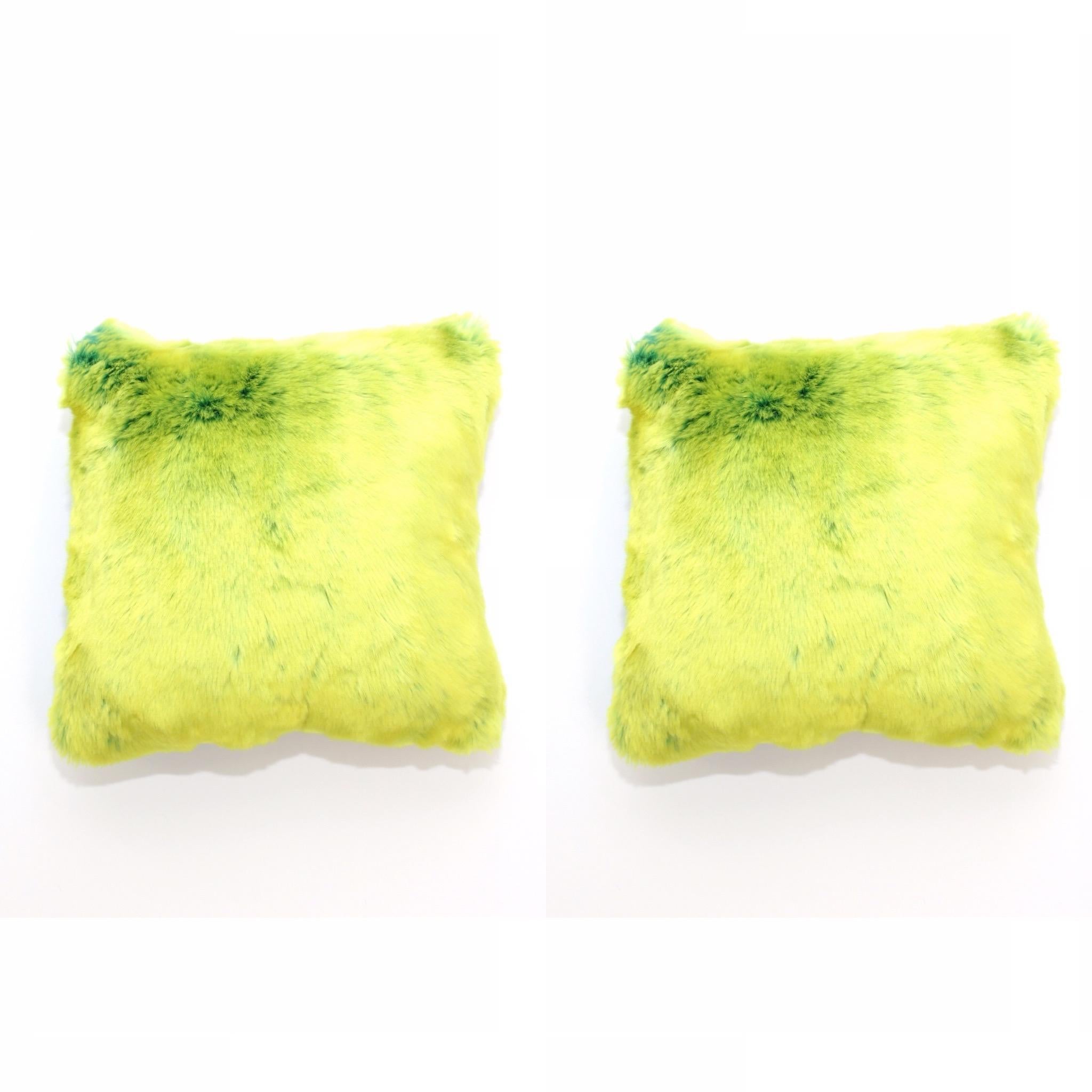 This pair of lime green faux fur accent pillow set are made with the highest quality man made pelage and are a beautiful replica of the chinchilla fur. Extra soft and silky to the touch, they can be reverse to a beautiful floral Italian silk print.