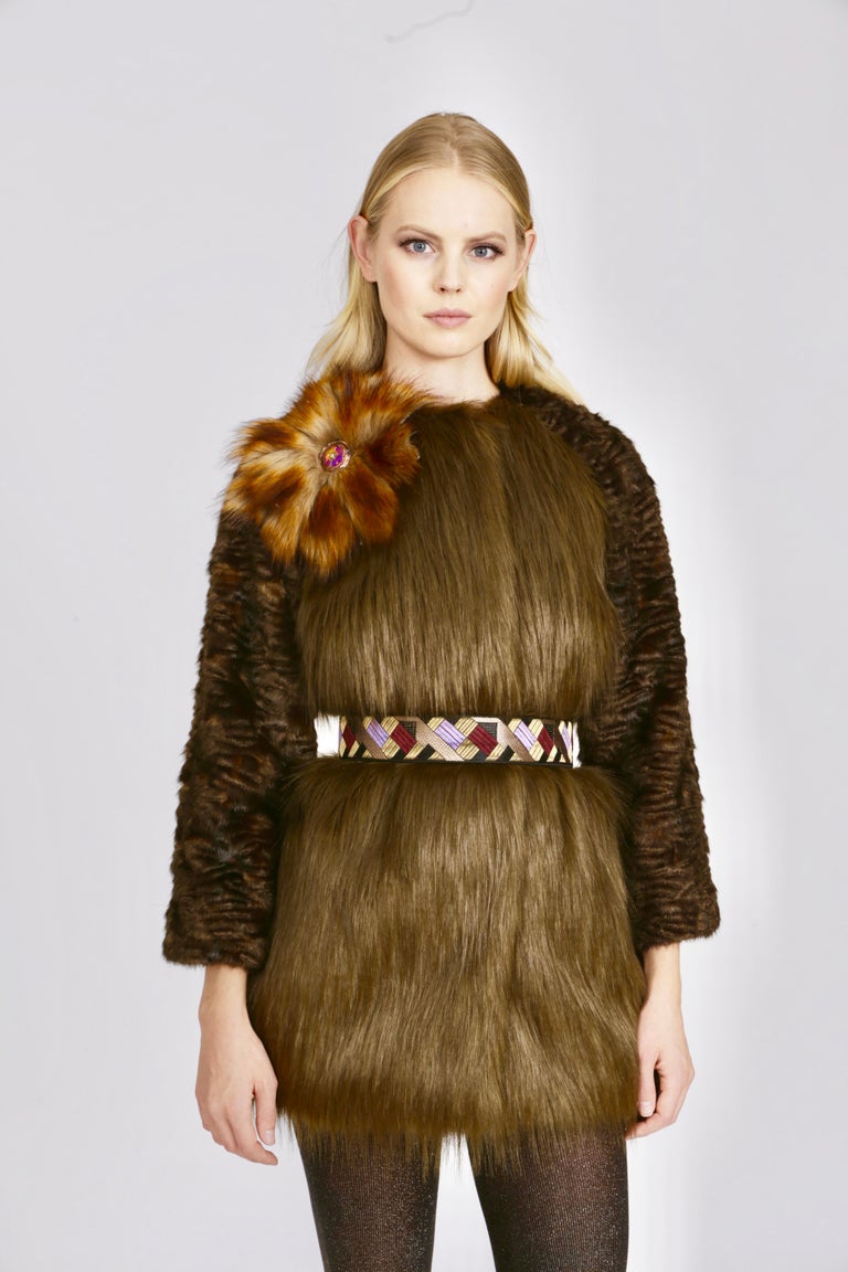The Olivia Pelush moss green and brown faux fur jacket is a one of a kind exclusive piece. Featuring the highest quality man made pelage this distinctive fur free jacket short coat is a beautiful replica of the long hair fox and Persian lamb Karakul