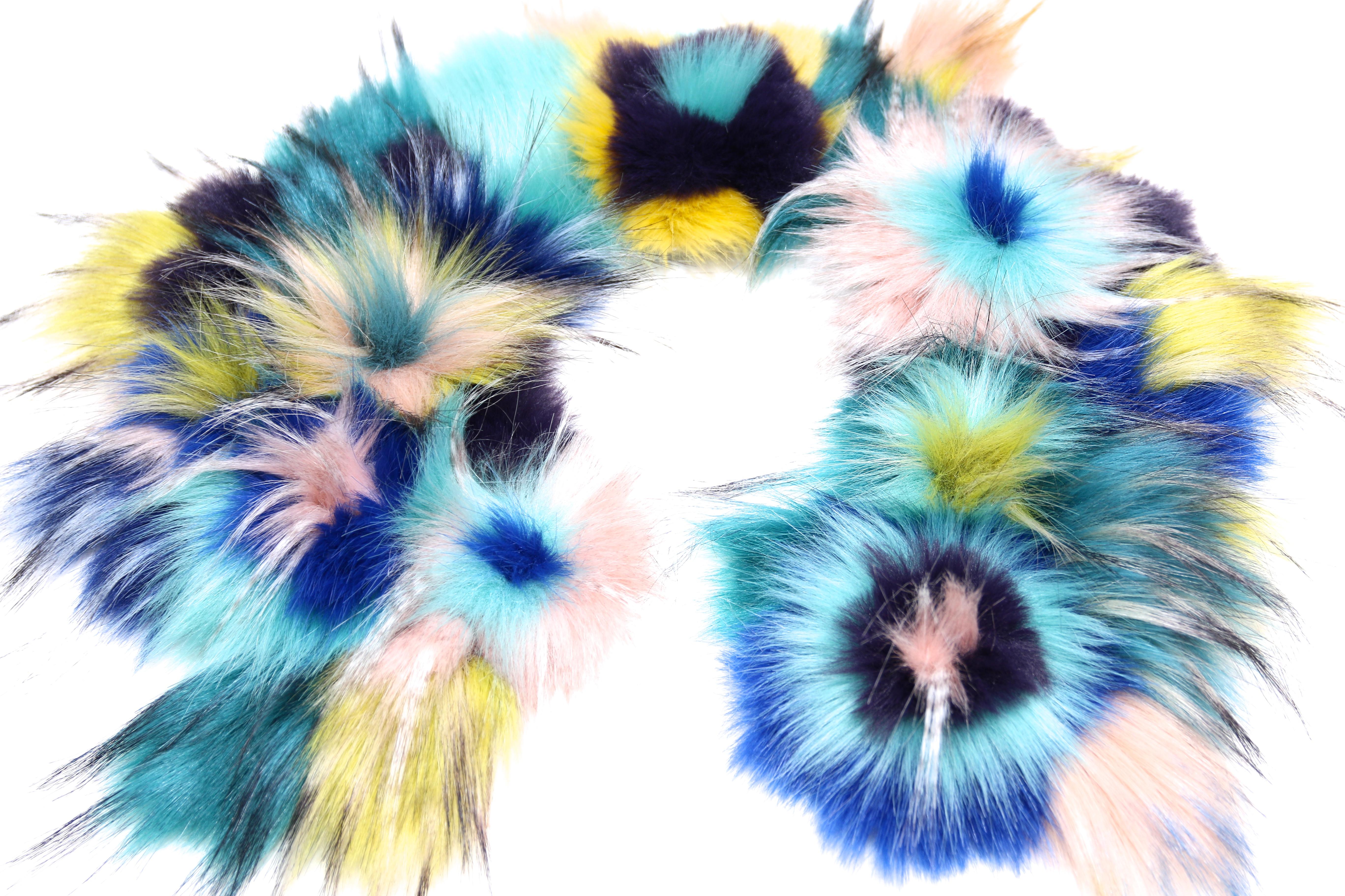 The Violetta Pelush multi color faux fur collar with three dimensional flowers is a one of a kind exclusive Couture piece. Featuring the highest quality man made pelage, this unique and playful accessory is a beautiful reproduction of the fox, mink
