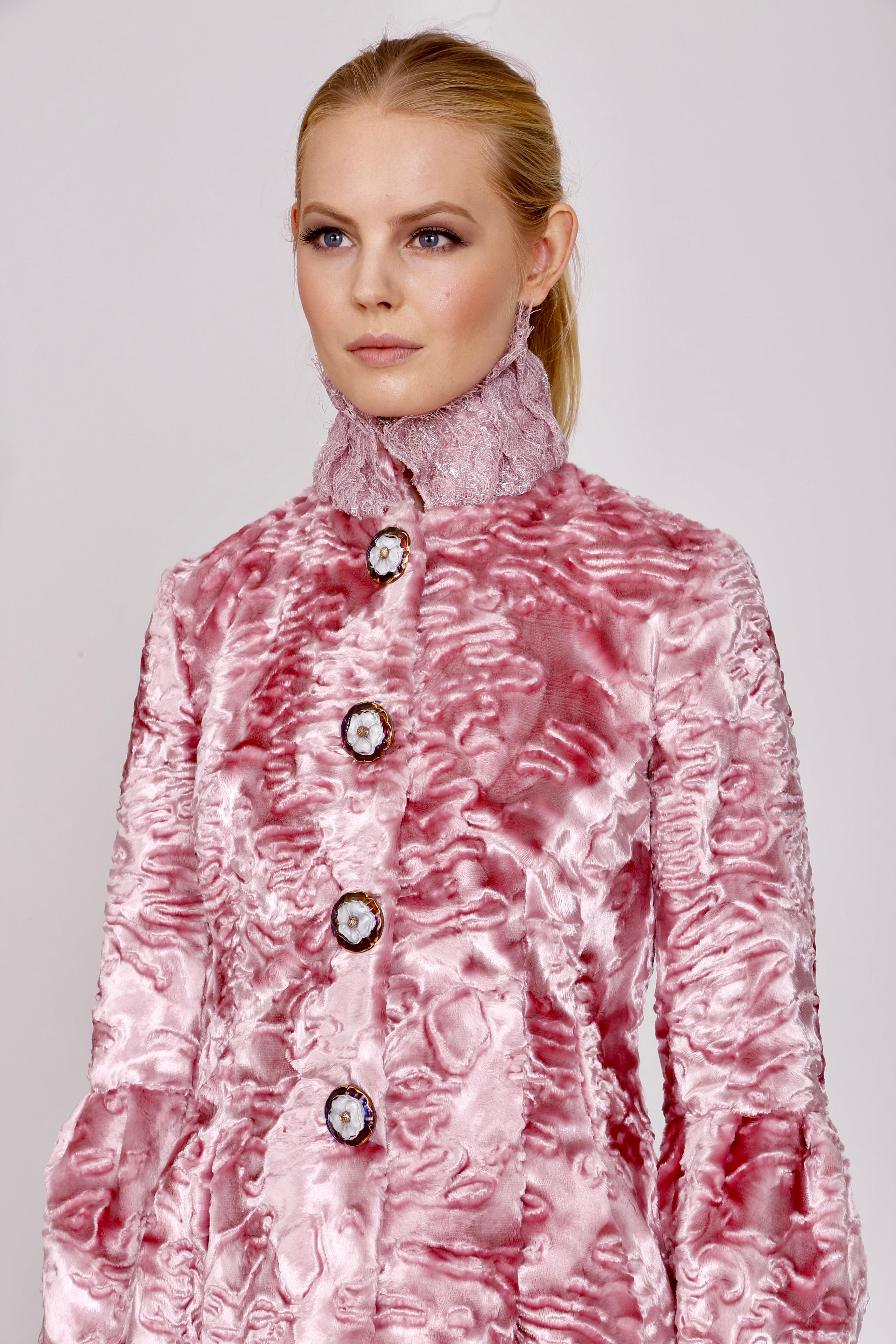The Veronica Pelush pink faux fur coat with vintage glass buttons is a one of a kind exclusive piece. This eye-catching unique fitted fake faux fur coat is crafted with the highest quality custom made pelage for Pelush. The rich and sumptuous