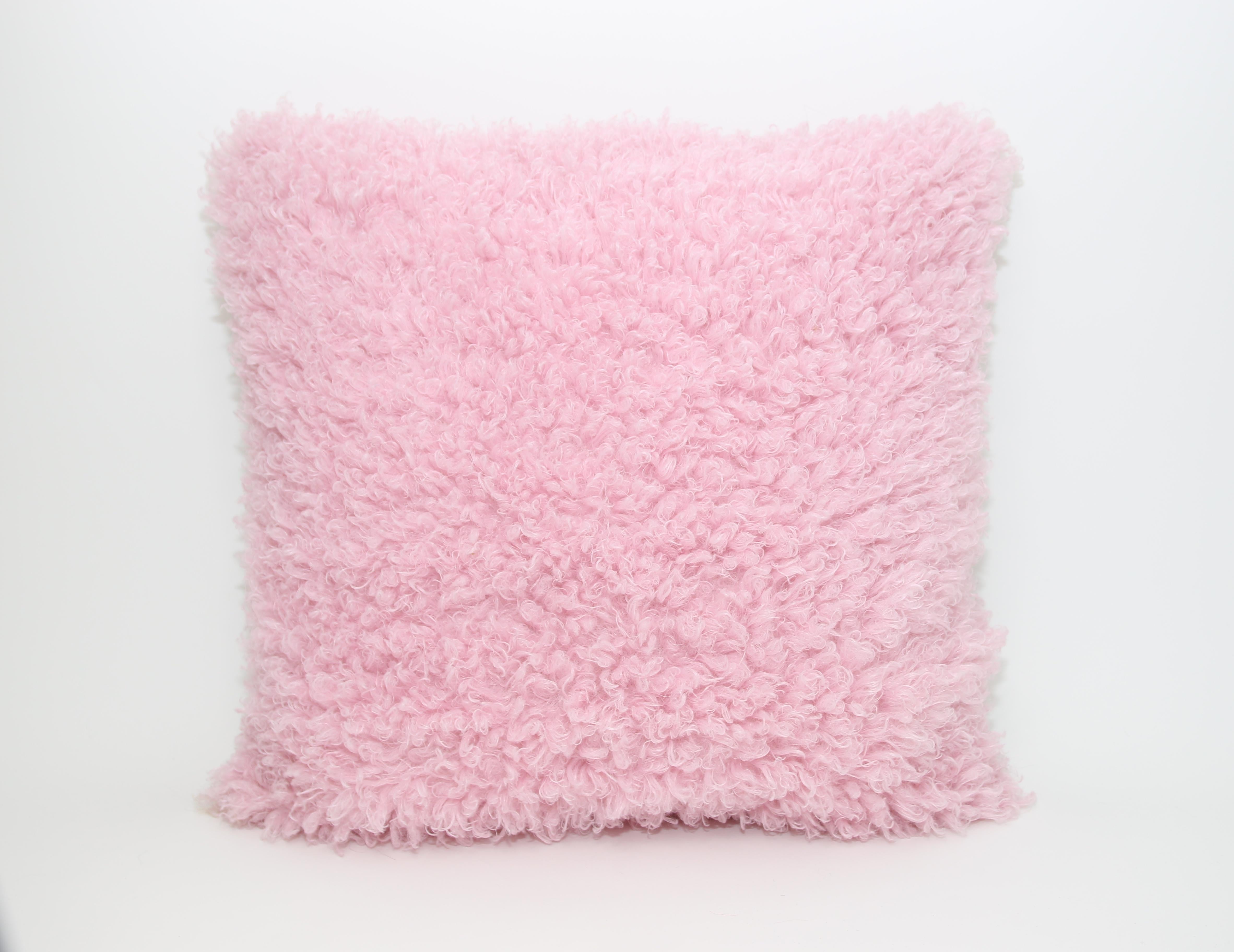 This pair of Pelush pink poodle faux fur pillows are made with a custom boucle' poly fabric and recycled Italian silk backing. The inside filling is down alternative. Match these cotton candy large pink fake fur pillows with the same throw blanket