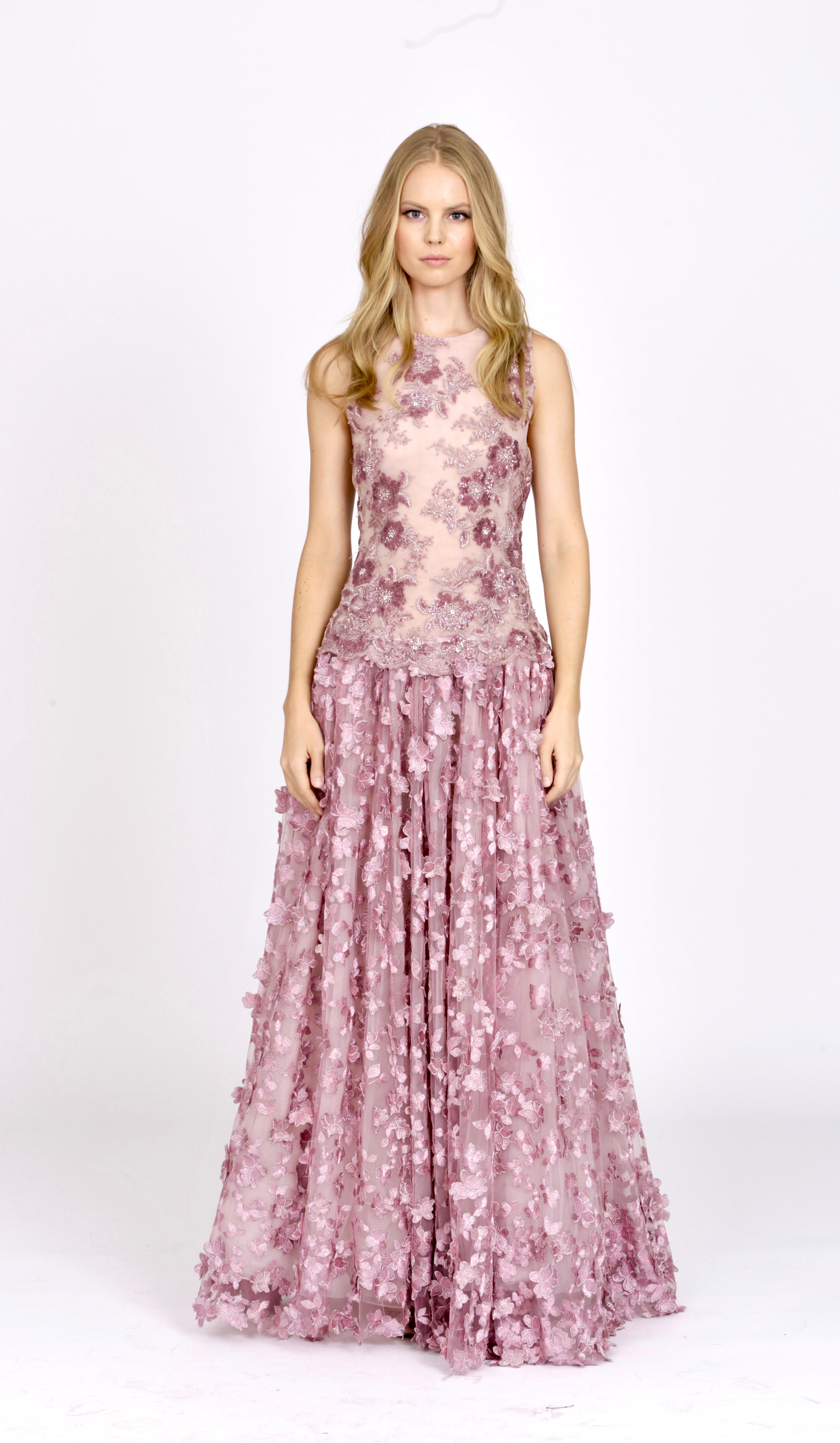The Grace Pelush pink tulle dress gown with three dimensional flowers and embroidery is a one of a kind exclusive Couture piece. Adorned with cascading butterfly floral petals, lace sparkling sequins, pearls, metallic lurex threads and constructed