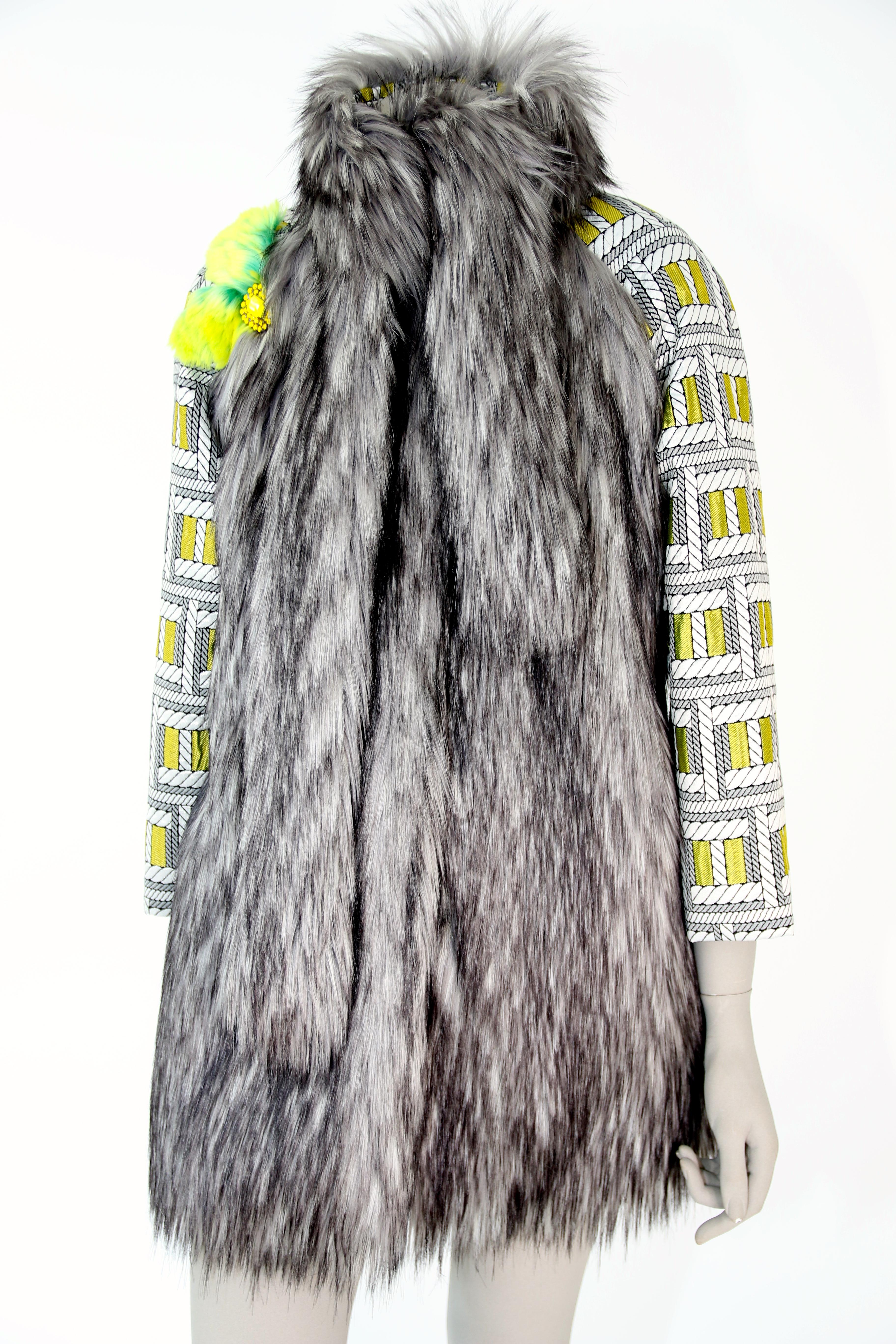 The Lulu Pelush silver gray faux fur fox jacket with brocade sleeves is a one of a kind exclusive piece. Featuring the highest quality man made pelage this unique fur free jacket is a beautiful replica of the long hair silver fox fur. Soft and