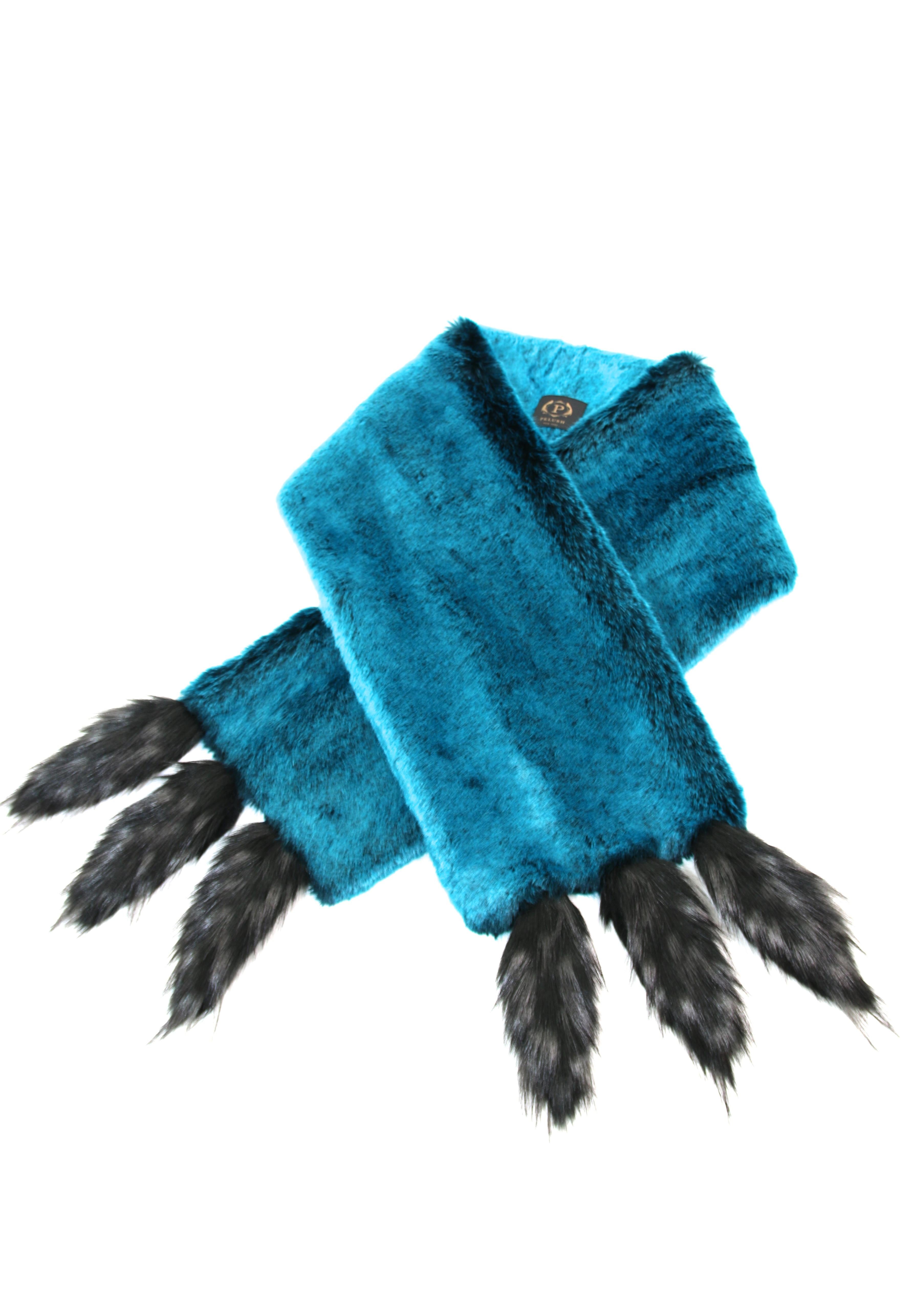 The Anais Pelush teal faux fur chinchilla stole with faux fox fringes is a one of a kind exclusive piece. Featuring the highest quality man made pelage, this eye- catching stole is an extraordinary replica of the chinchilla fur and fox fur.