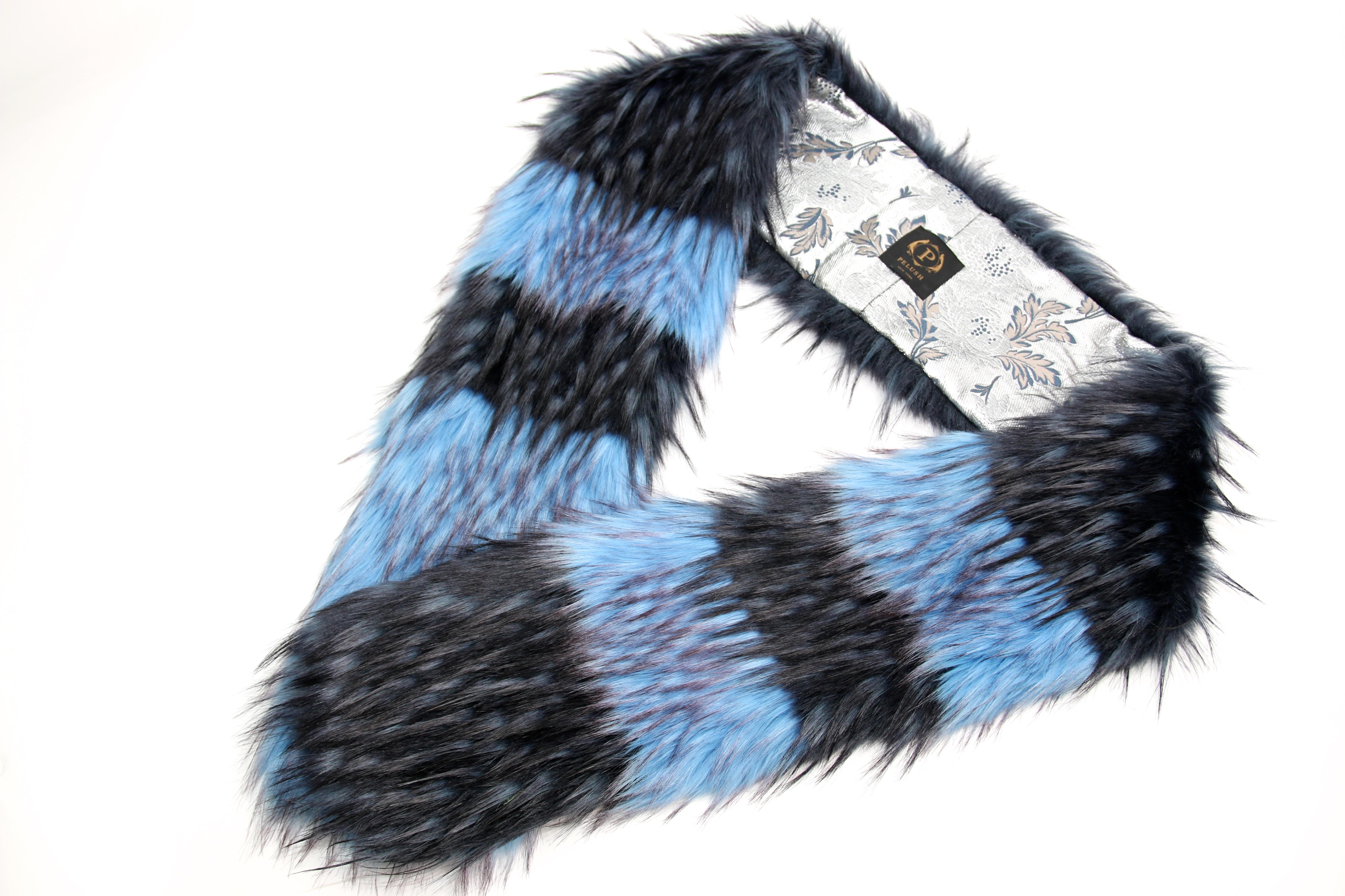 The Seuss Pelush turquoise and navy blue faux fur fox scarf/stole is a one of a kind exclusive piece. Featuring the best man made pelage, this stylish fur free scarf/stole is a beautiful replica of the long hair fox fur. Fun, glamorous and timeless.