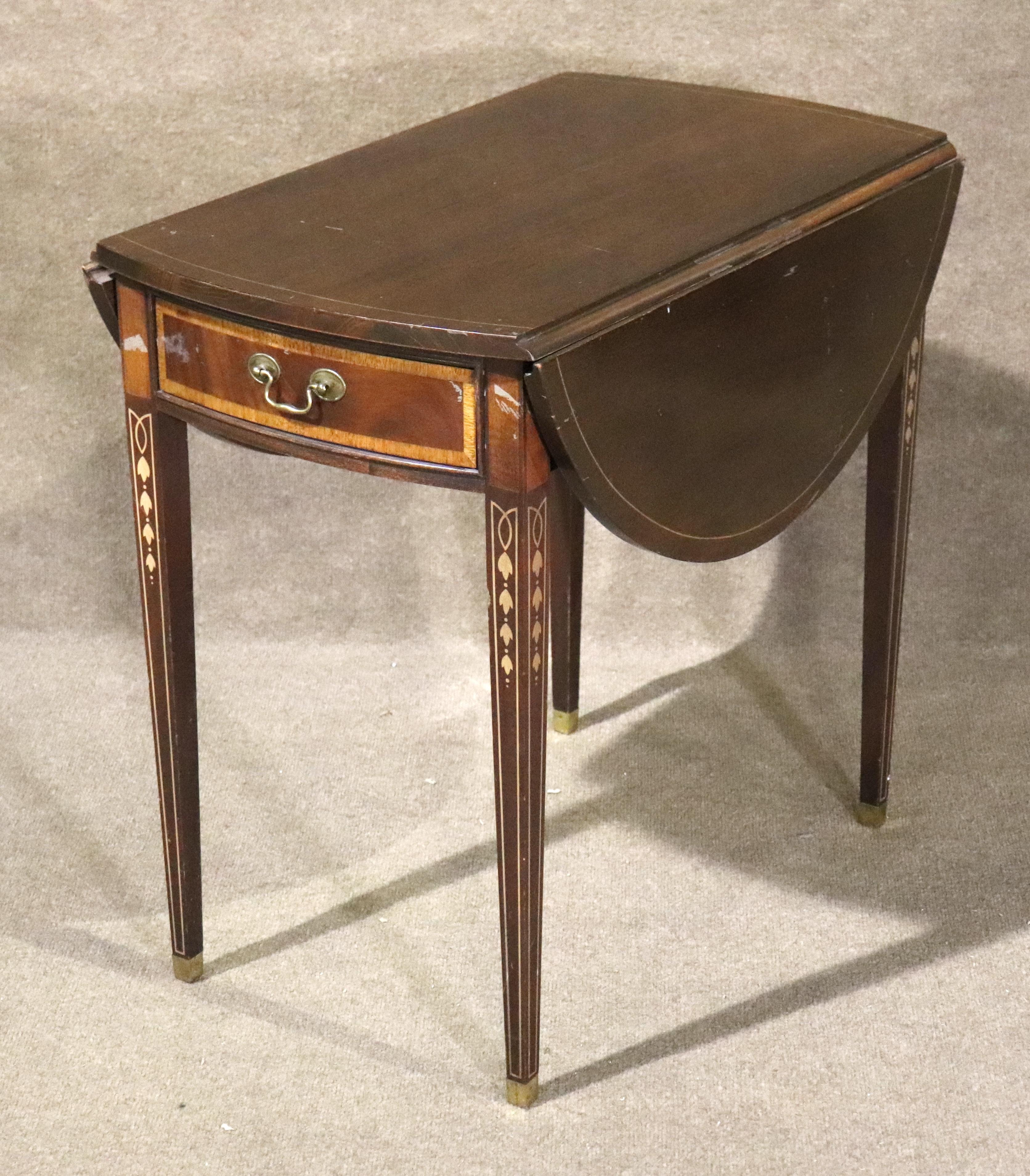 This side table is decorated with inlaid wood design throughout, with two drop leaves and center drawer. Beautiful art nouveau design on each leg. This table is great for entertaining.
Please confirm location NY or NJ 