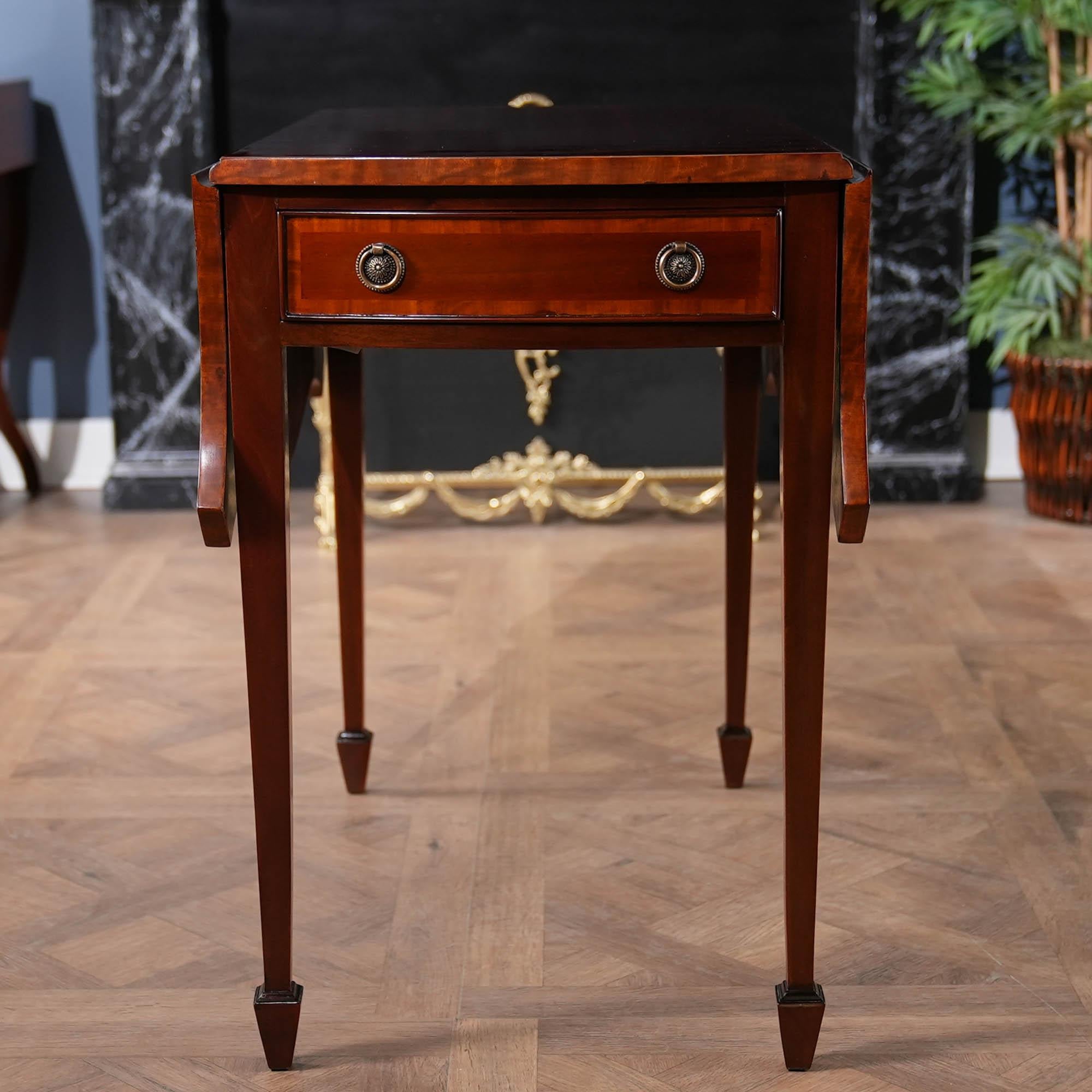 This beautiful Mahogany Pembroke Table from Niagara Furniture will be recognizable to anyone familiar with fine antiques. Originally designed by Henry Herbert, 9th Earl of Pembroke, the form was made popular by various furniture designers in 18th