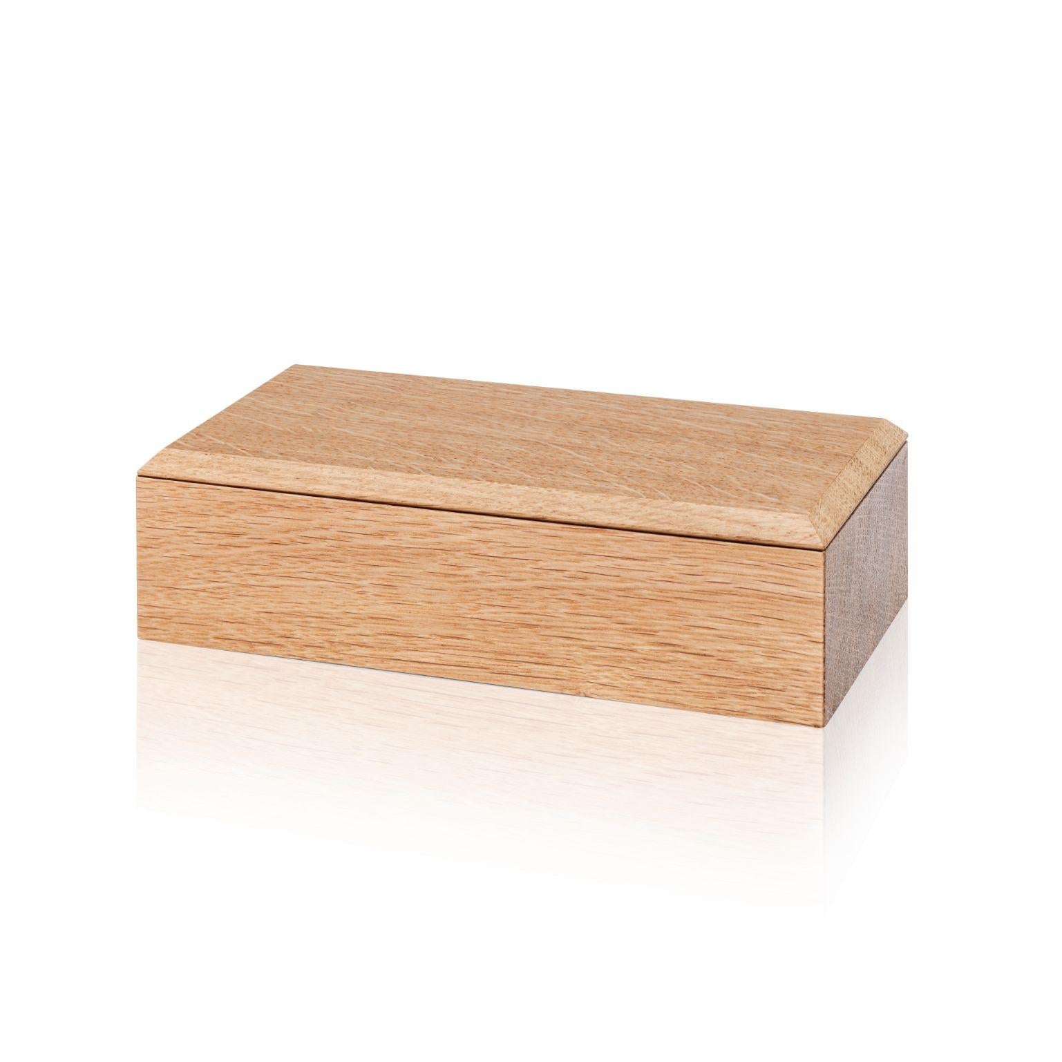 Pen Pino Boxes by Antrei Hartikainen
Materials: Oak, Natural Oil Wax
Dimensions: W 18 / 14, D 9, H 5 / 7cm

A set of three vertical and two horizontal stacking boxes constructed of vividly grained woods. The pino boxes may be arranged in various