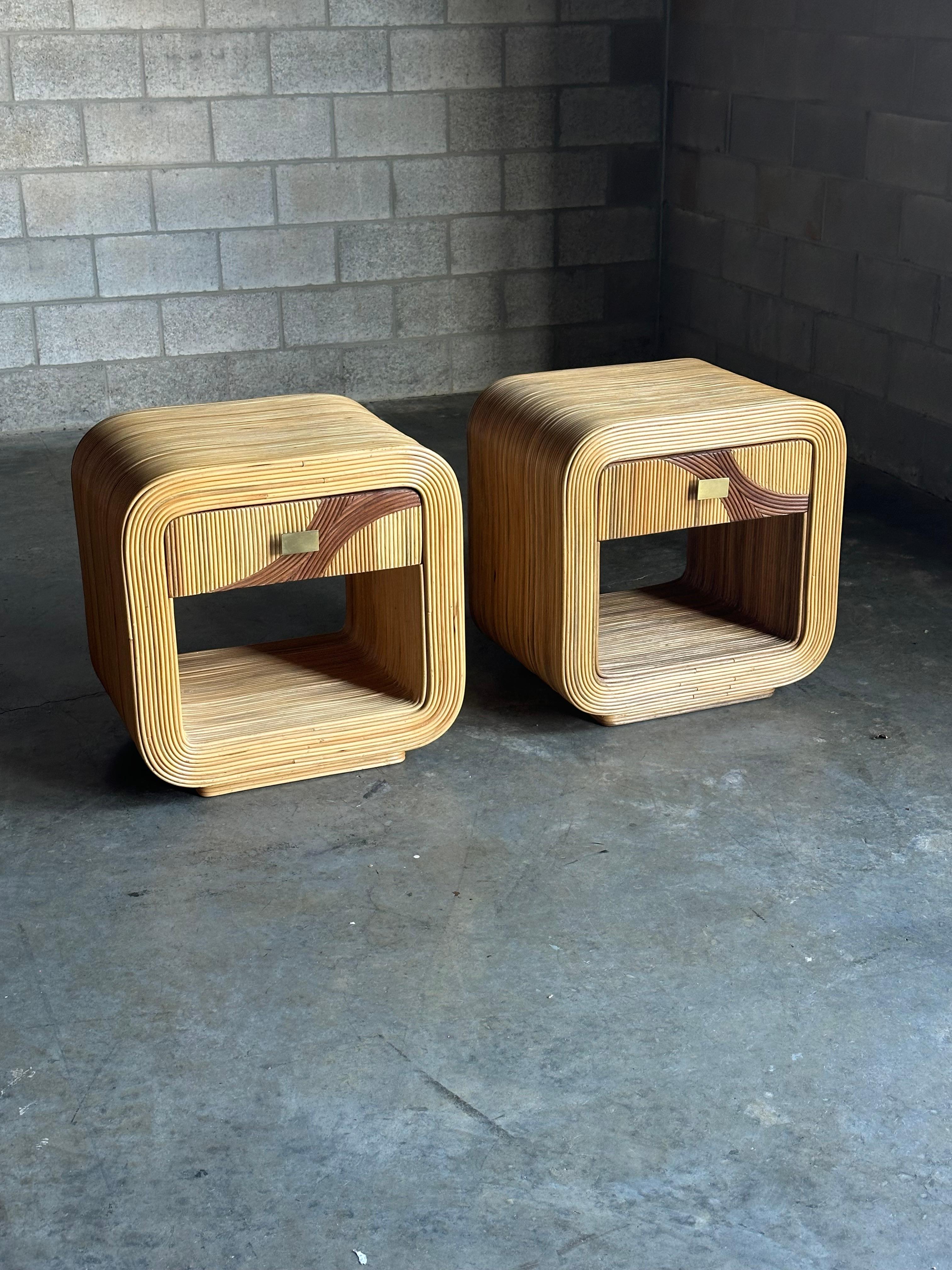 Wonderful pencil reed nightstands with great organic styling. Features darker reeds to create beautiful movement through drawer fronts. Waterfall edges and patinated brass hardware complete these beautiful pieces. Would work in a variety of