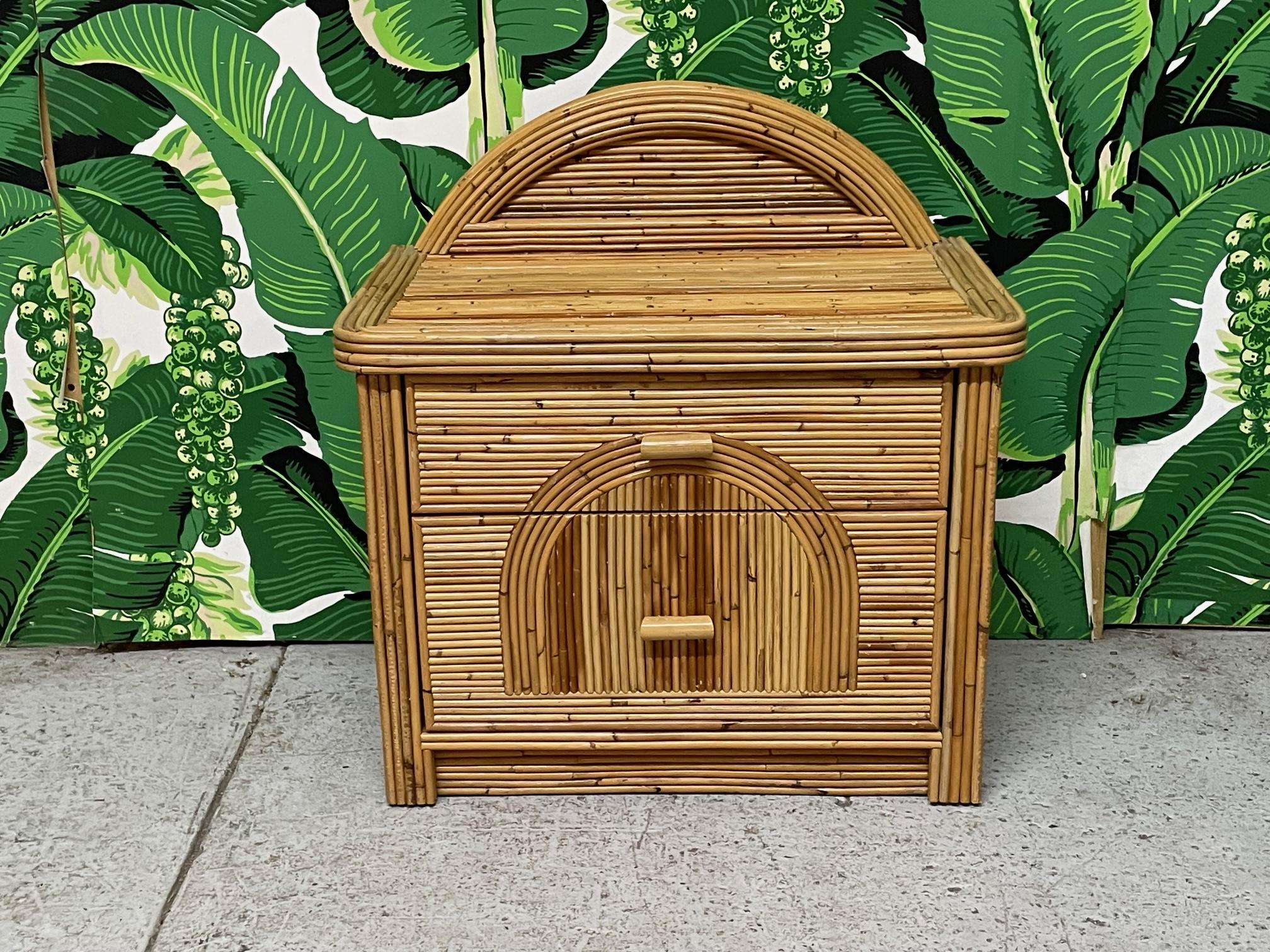 Single vintage nightstand in full veneer of pencil reed rattan in the style of Gabriella Crespi or Betty Cobonpue. Arched design on top and on drawer fronts in a unique sunburst design. Very good condition with only minor imperfections consistent