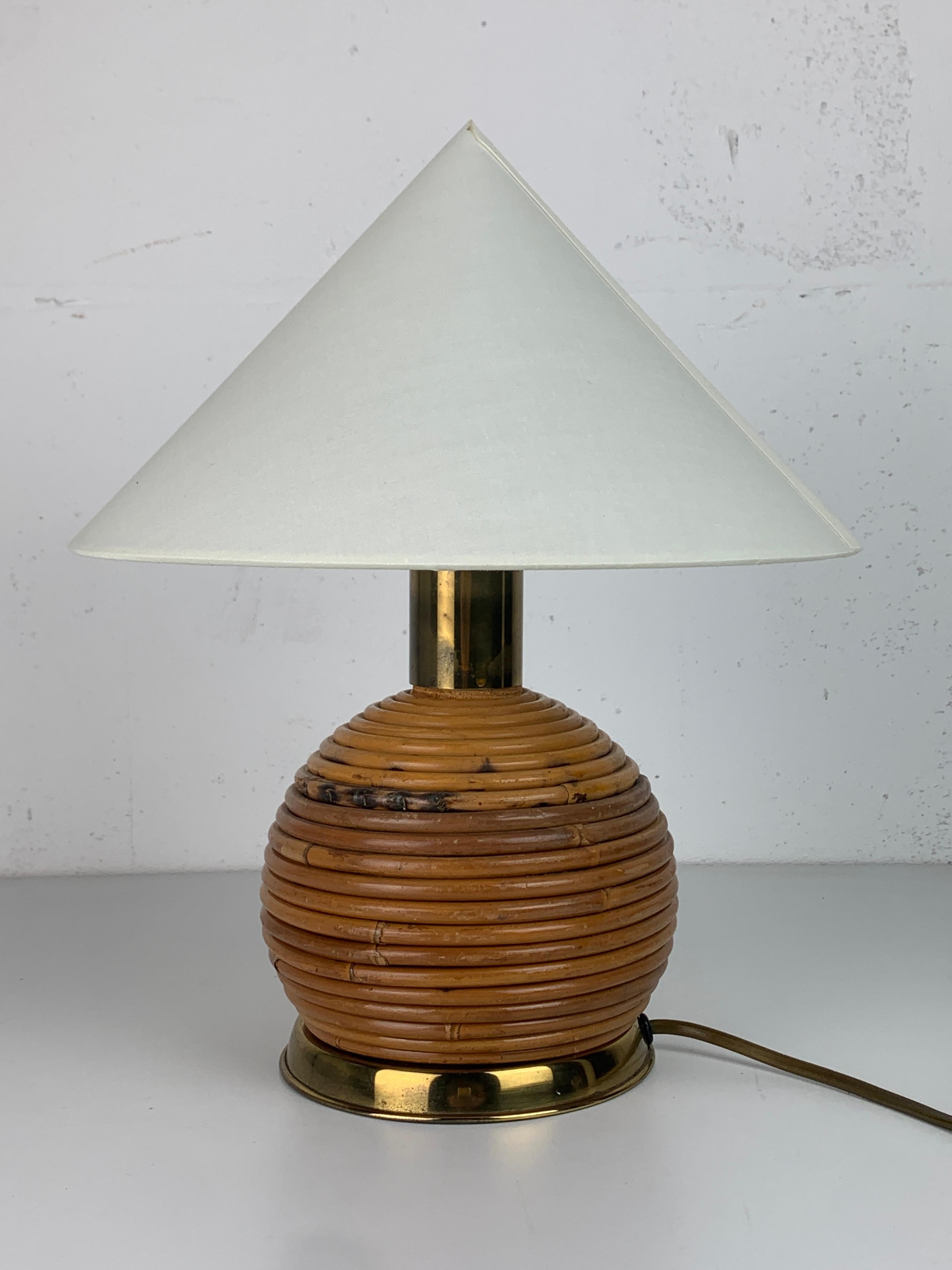 Lovely little pencil reed rattan table lamp with brass. This lamp will come with the shade as shown in the pics. Some small imperfections in the shade but as a starter a lovely addition. Th lamp is fitted for a general E27 lightbulb. We currently
