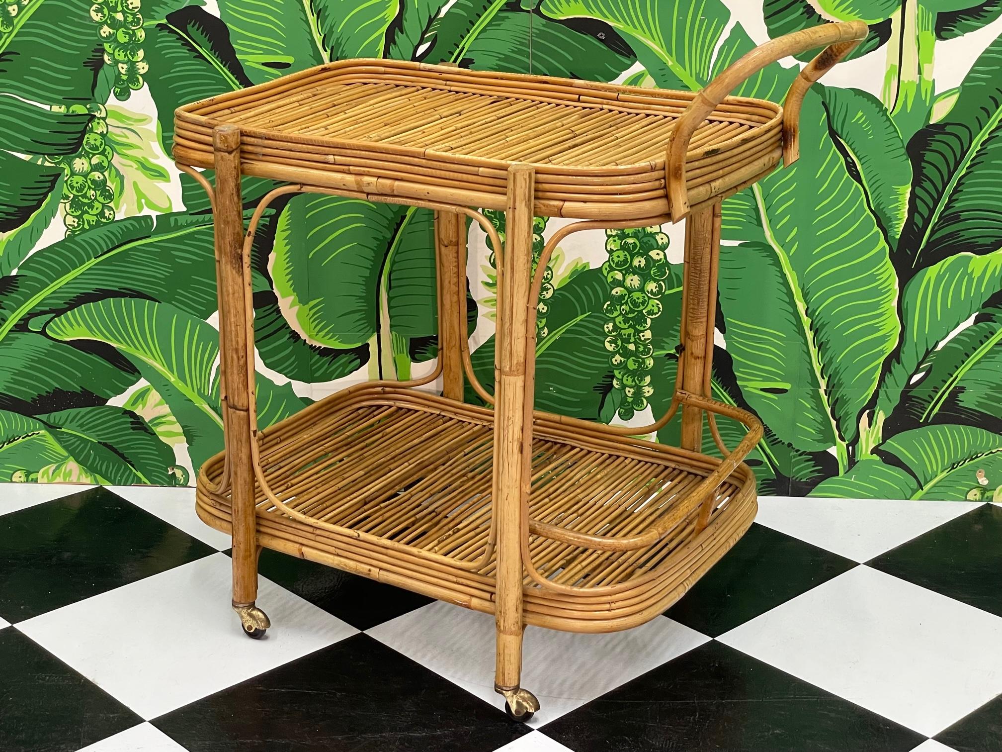 Rattan bar cart features pencil reed platforms and brass castors. Good condition with minor imperfections consistent with age, see photos for condition details.
For a shipping quote to your exact zip code, please message us.
