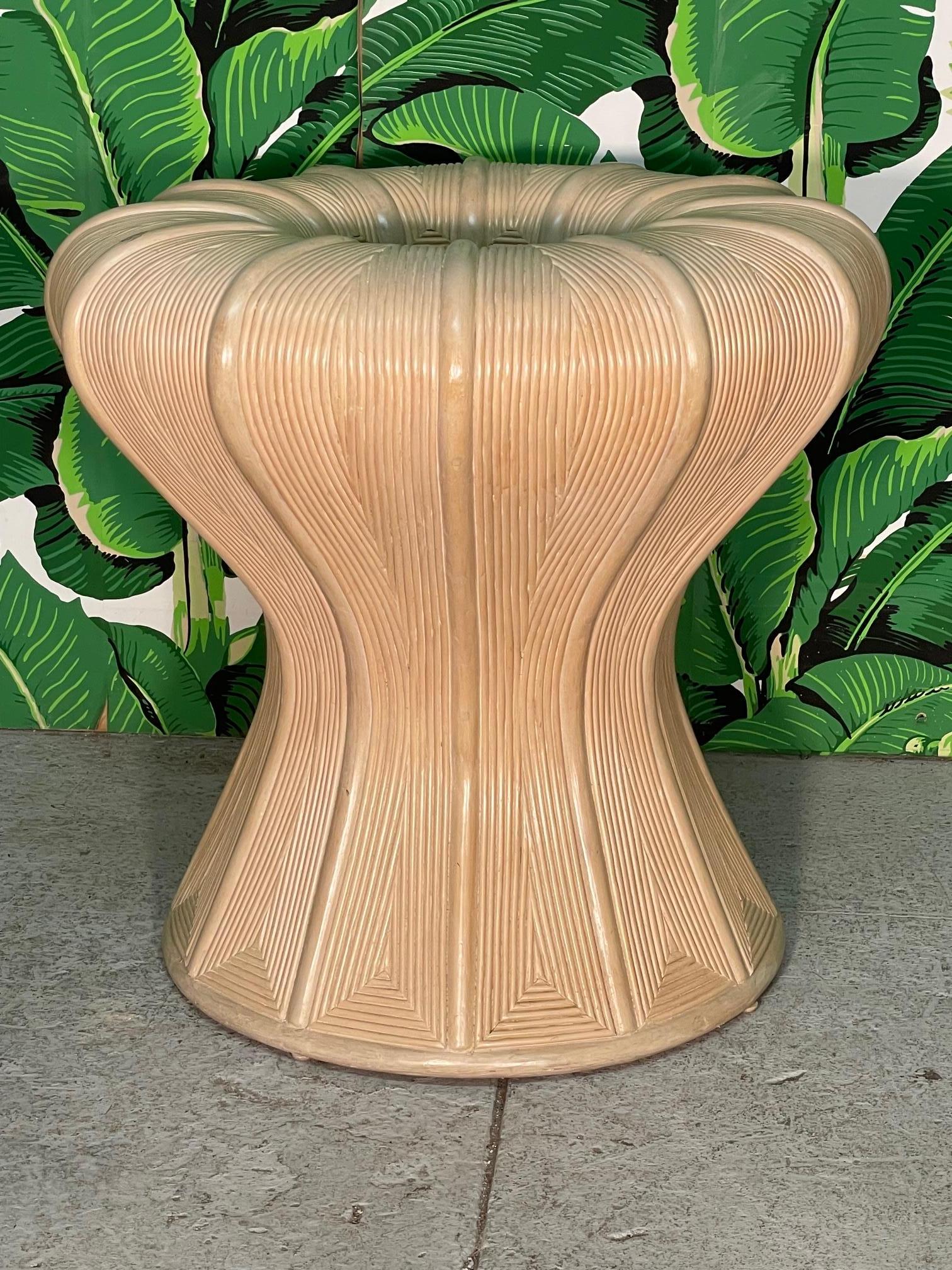 Vintage sculptural table base features full veneer of pencil reed rattan in a decorative geometric design. Able to hold up to a 60