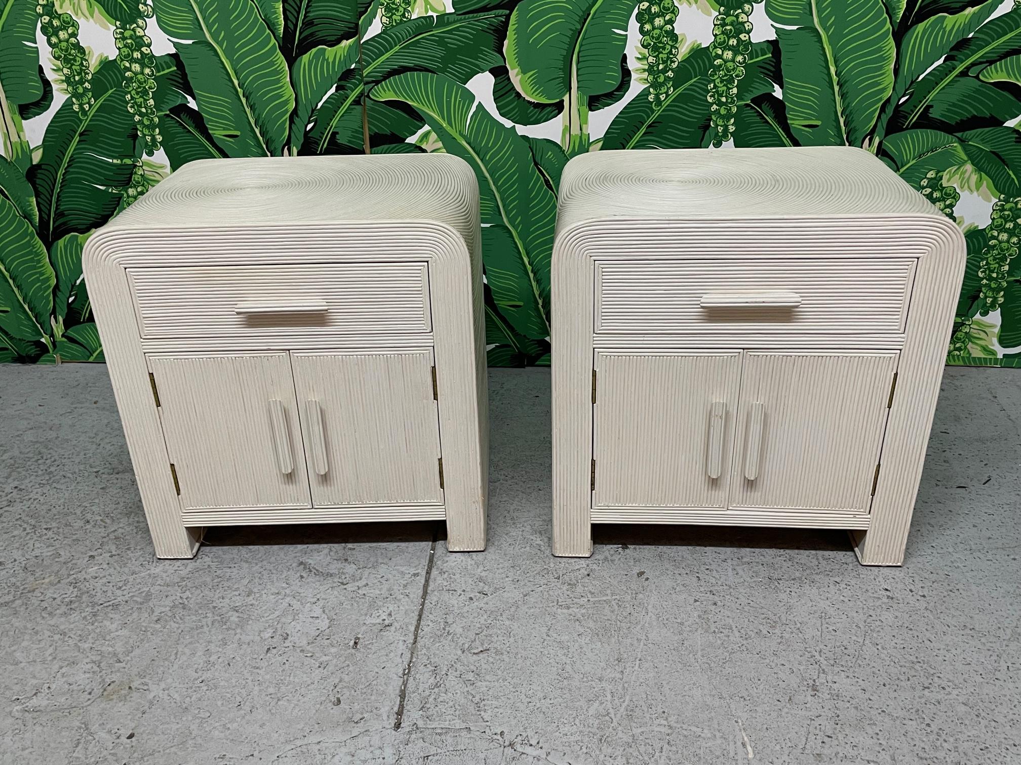 Pair of vintage waterfall nightstands in a full veneer of pencil reed rattan. Good condition with imperfections consistent with age, see photos for condition details.
For a shipping quote to your exact zip code, please message us.

 