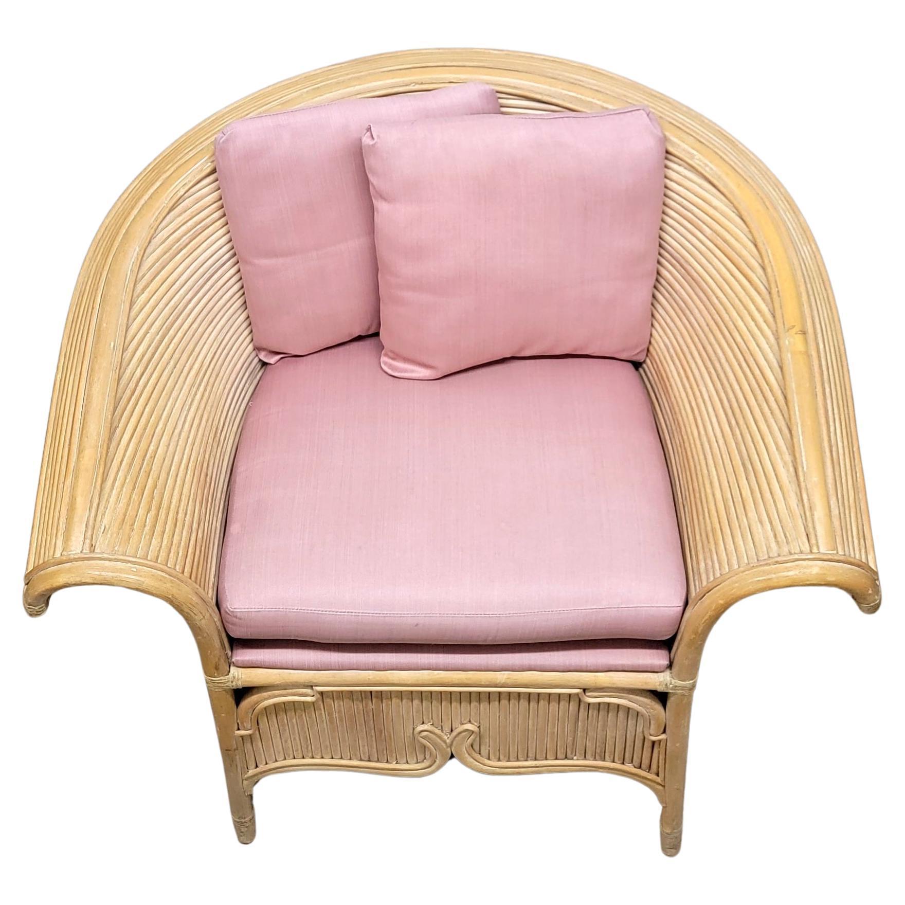 A gorgeous vintage fan back pencil-reed split bamboo armchair dating from the 1970s. The hand-crafted barrel shaped back imparts a superior level of comfort all while adding a Chinoiserie inspired wow factor to your Palm Beach, coastal or boho chic