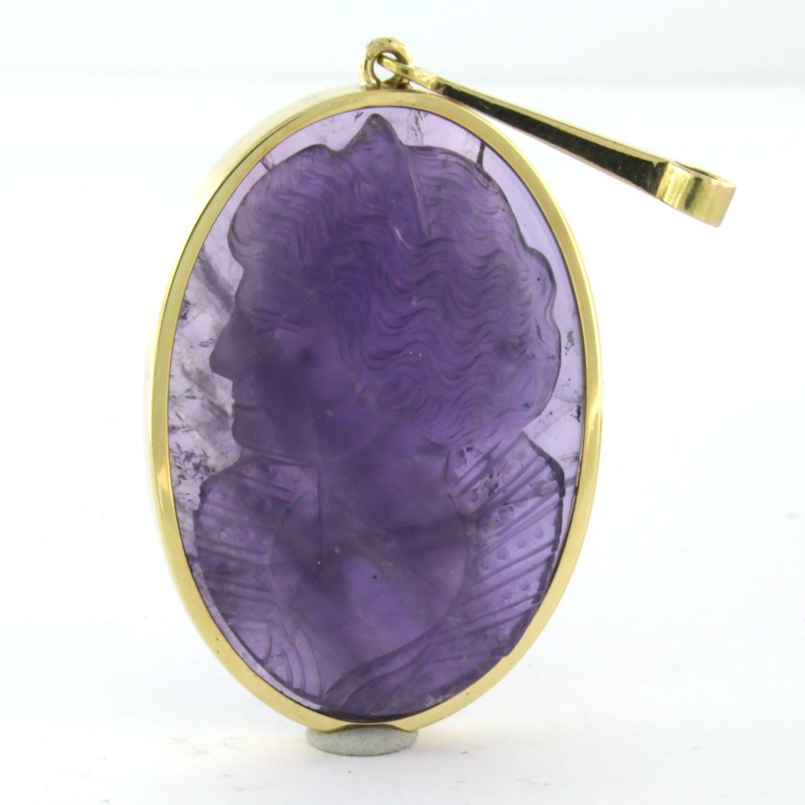 14k yellow gold pendant, set with cameo cut amethyst of a ladies portrait

Detailed description:

The pendant is 6.6 cm long by 3.0 mm wide

weight 17.8 grams

Set with

- 1 x 3.7 cm x 2.7 cm cameo cut amethyst

color purple
clarity VS/SI
Gemstones