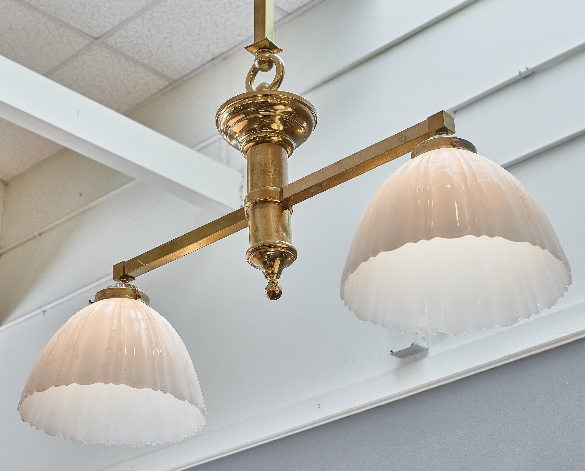A large American all original billiard table pendant light with a brass structure and opaline glass shades.