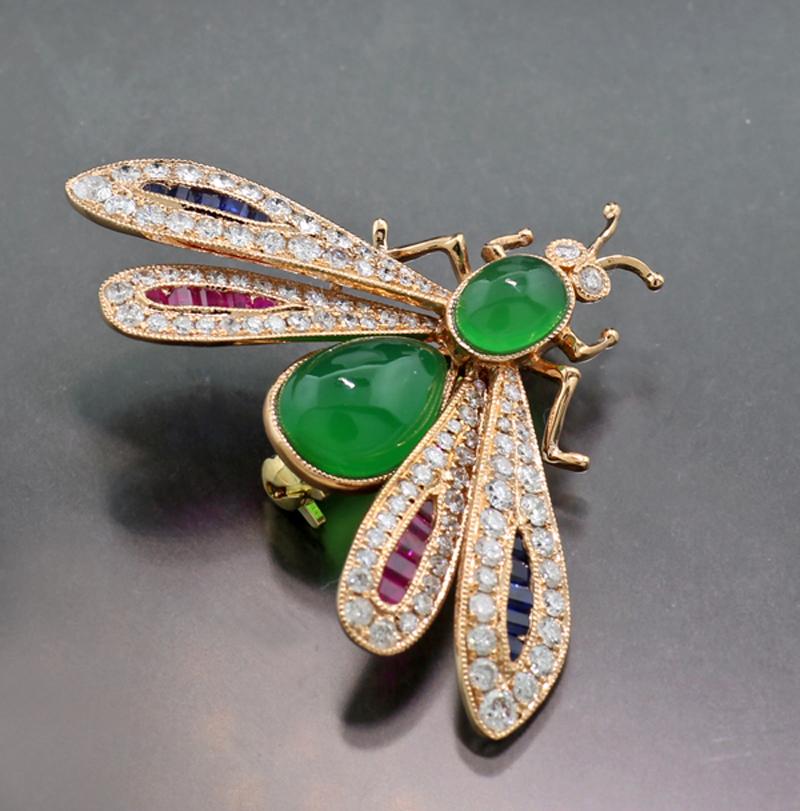 Animal motif jewelry: Pendant / brooch as dragonfly with two green agates in oval and pear cut, the four wings are set with a total of 12 blue sapphires approx. 0.20 carat in total, square and trapezoid cut and with  12 rubies approx. 0.20 carat in