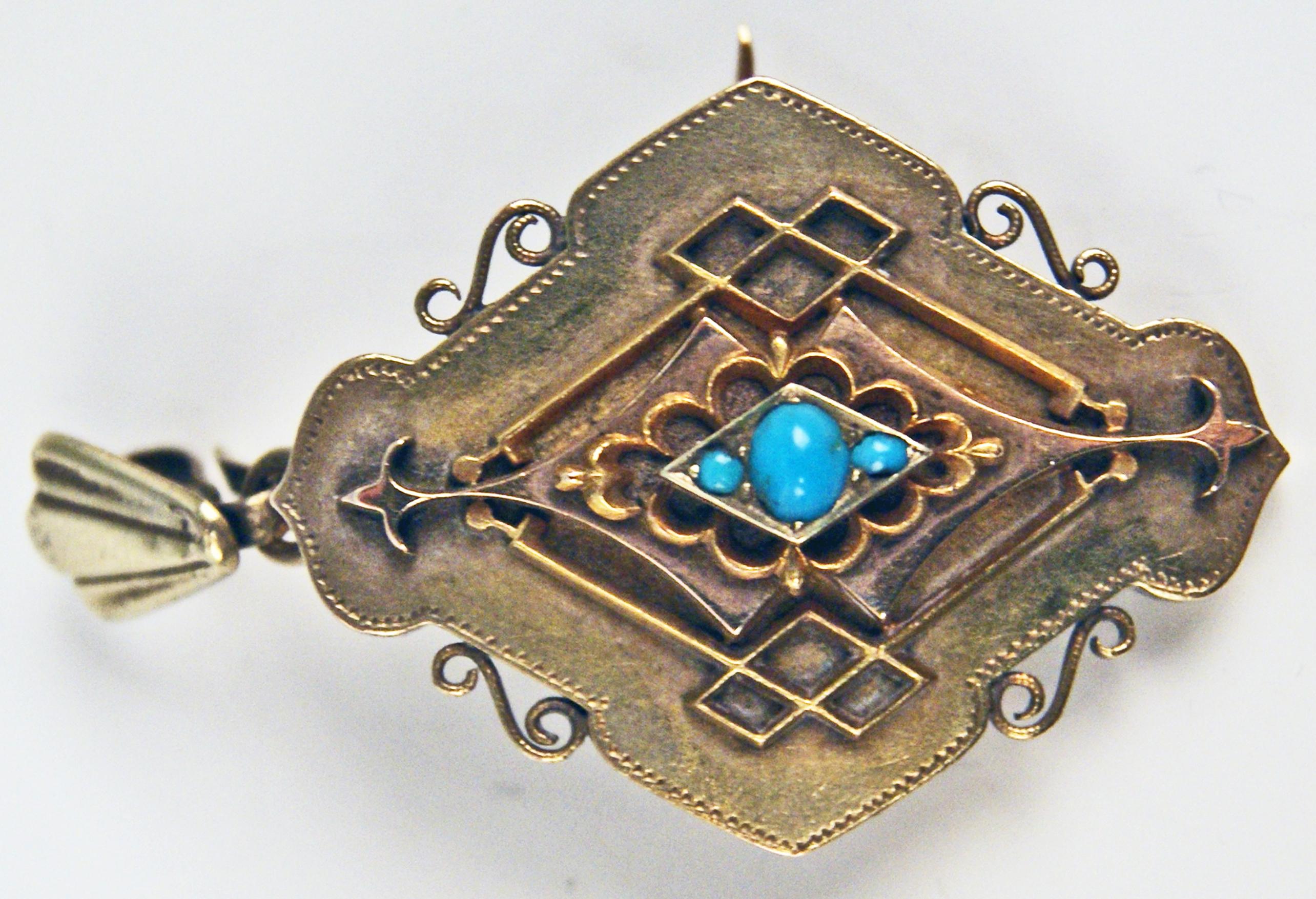 Very interesting pendant / brooch made during Viennese Late Biedermeier Period: 
It is of rhombic as well as of stylized form type to which three turquoises are attached to middle area / further, there are decorative bars showing a rhombic form