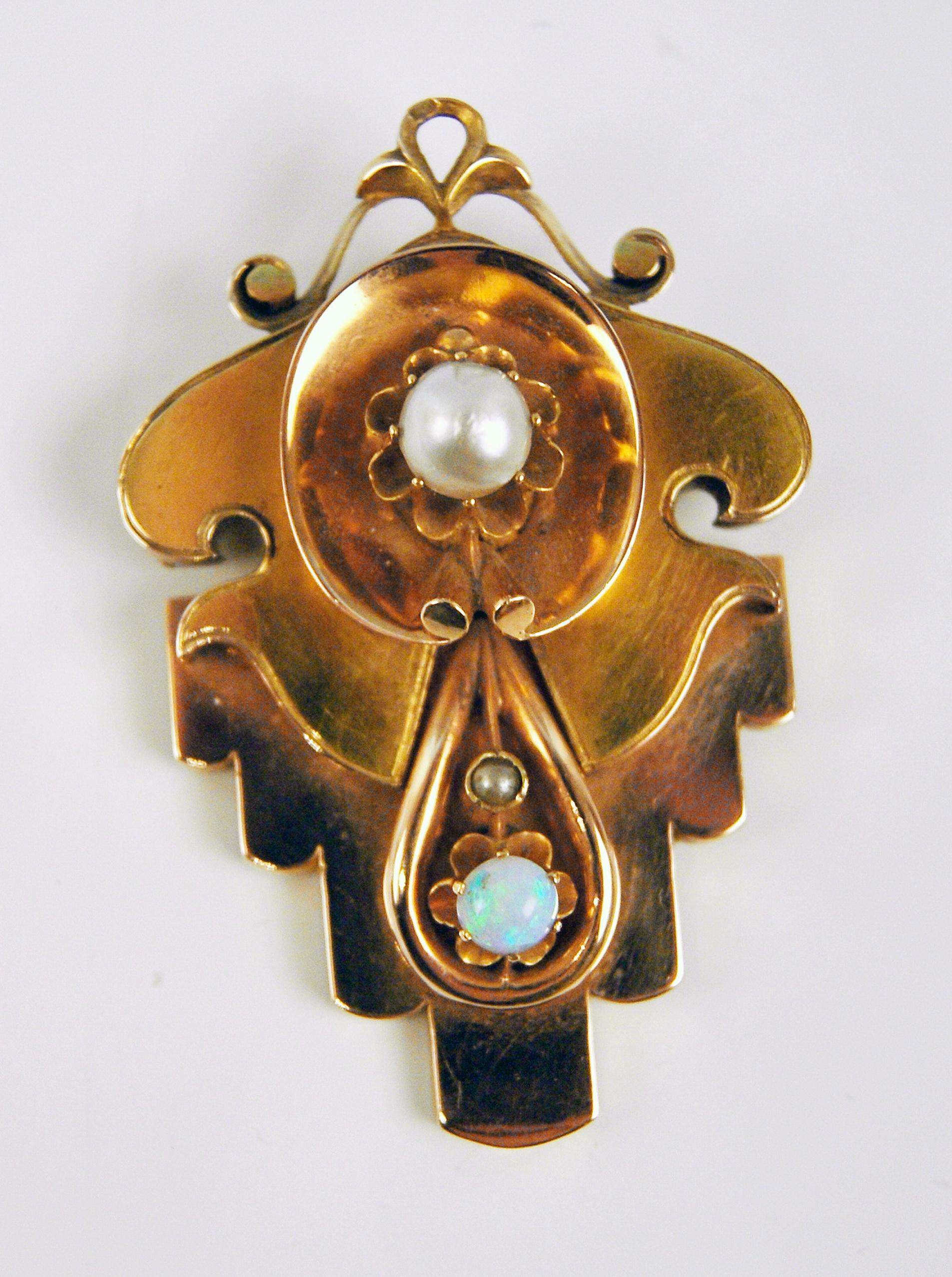 Very interesting brooch made during Viennese Late Biedermeier Period: 
It is of abstract as well as of stylized form type to which a large pearl is attached to top area of it / further, an opal and a smaller pearl are attached to area below - these