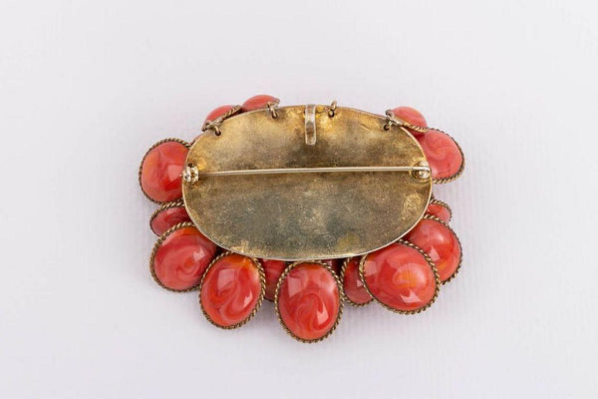 Pendant brooch in glass paste and gilted metal. Gripoix workshop, not signed.

Additional information:

Dimensions: 
5 cm (1.97 in) x 5 cm (1.97 in)

Condition: Very good condition

Seller Ref number: BRB130
